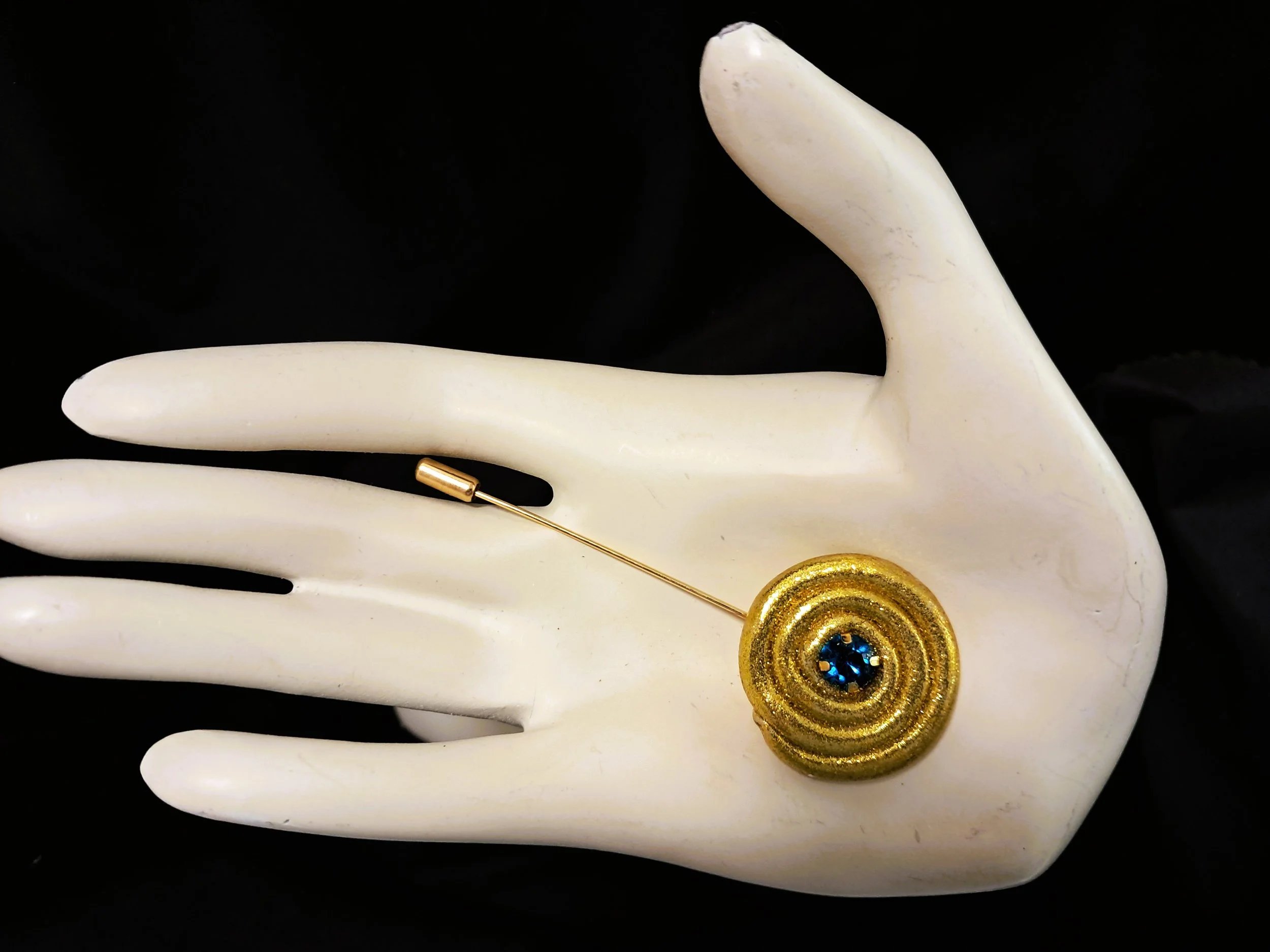 blue swirl pin hand.jpg
