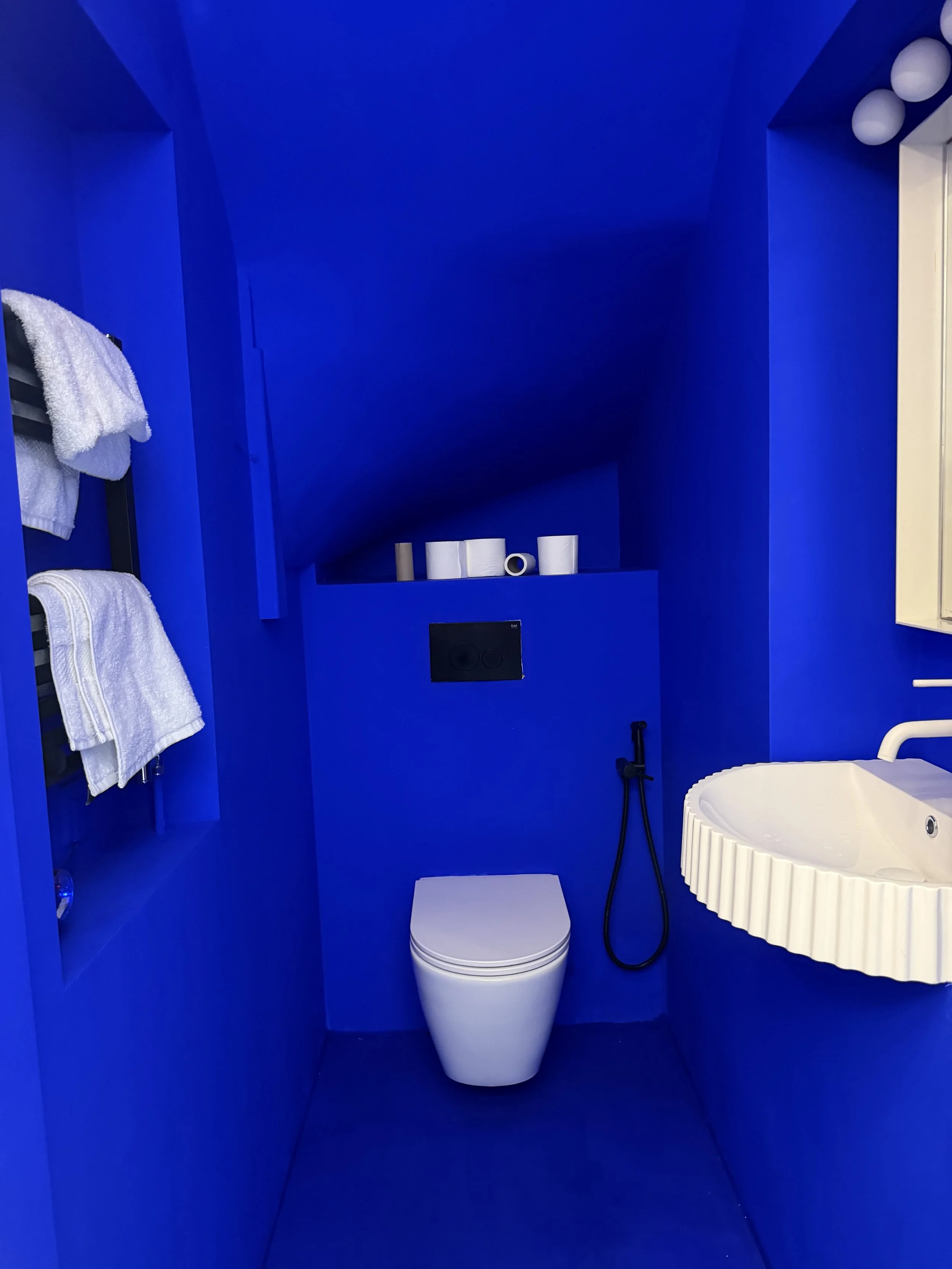 Deep blue bathroom interior at Cloud House in Gospel Oak, North London