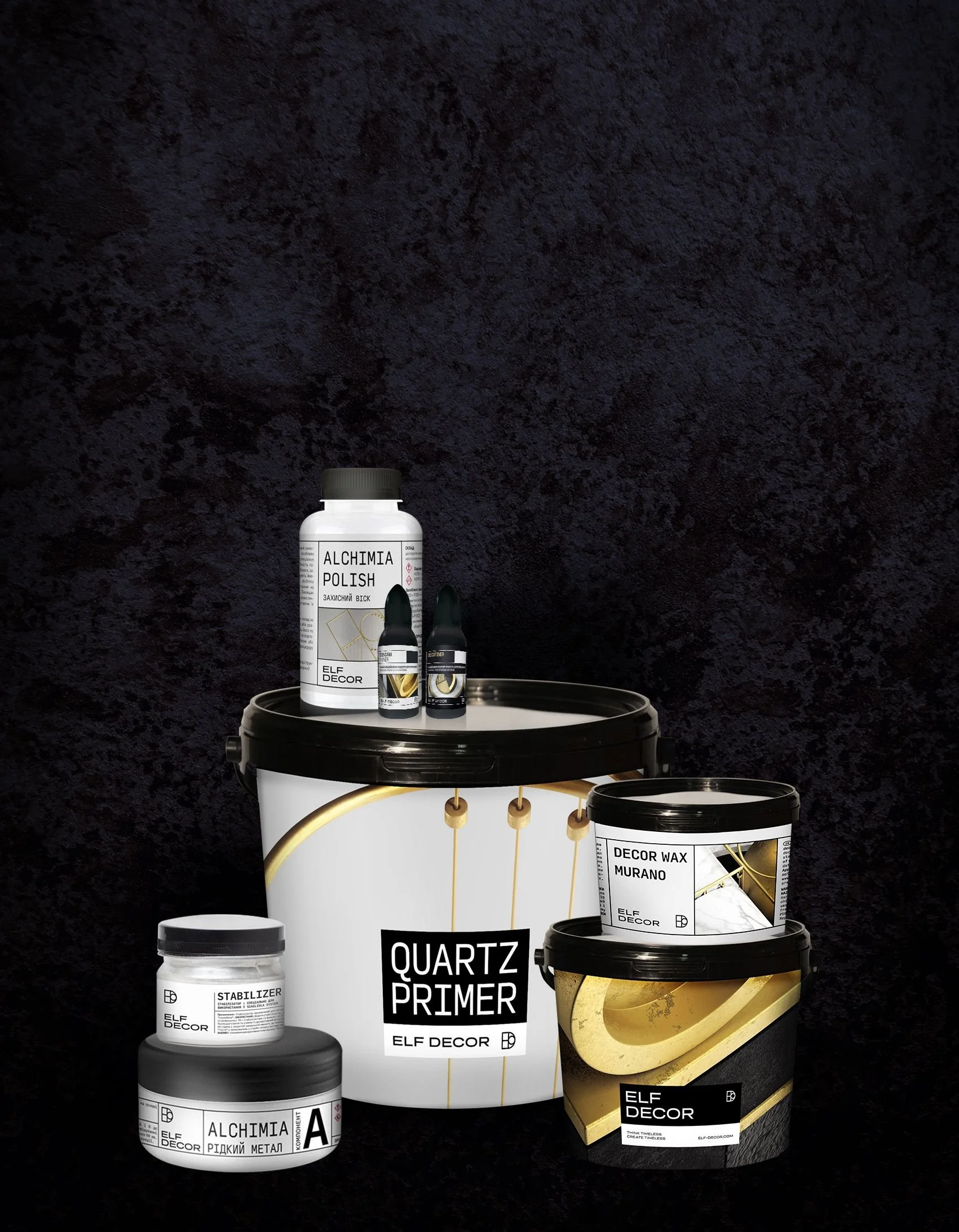Various bottles, containers, and cans of decorative art supplies, including primer, wax, paint, and metal liquid, arranged on and around a white bucket with black lid and a dark textured background.