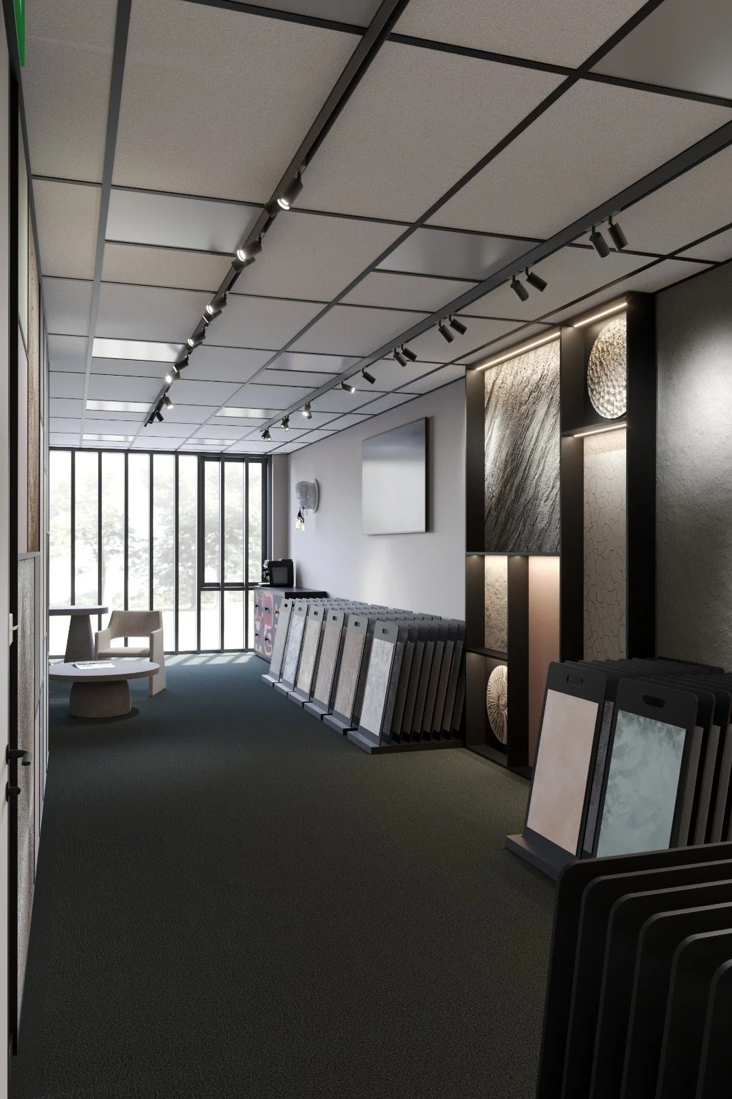Interior of a modern showroom displaying various tiles with a sitting area near a large window.
