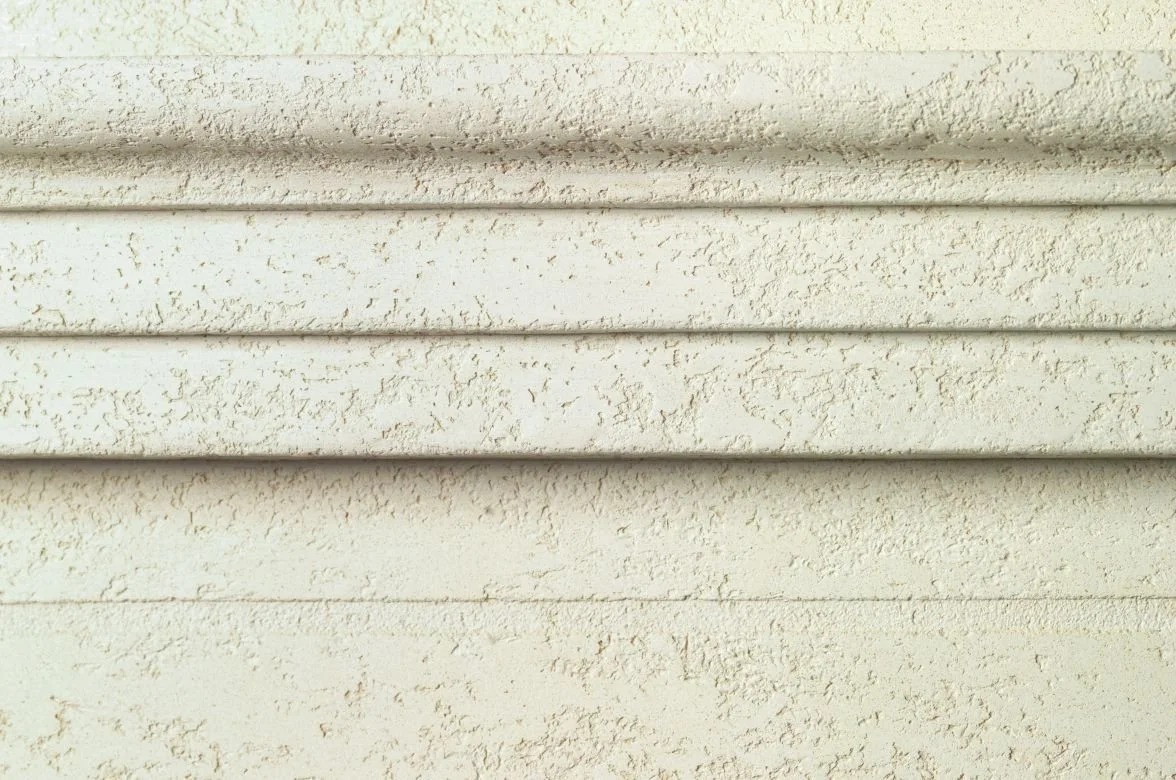 CASTELLO travertine stone coating sample, open pitted texture in Travertine White — Elf Decor · CASTELLO ground travertine coating sample, banded stone effect in Warm Beige — Elf Decor