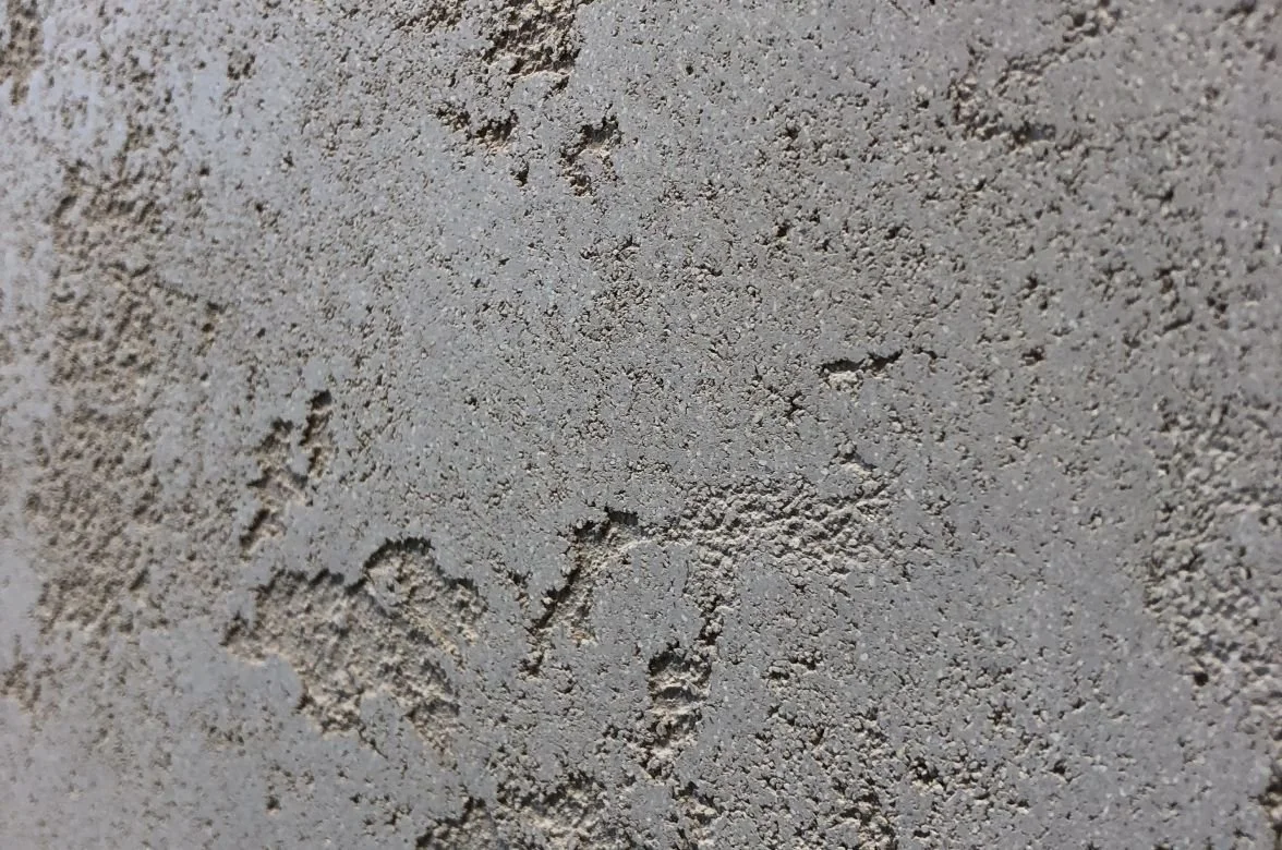 CASTELLO travertine stone coating sample, open pitted texture in Travertine White — Elf Decor · CASTELLO ground travertine coating sample, banded stone effect in Warm Beige — Elf Decor