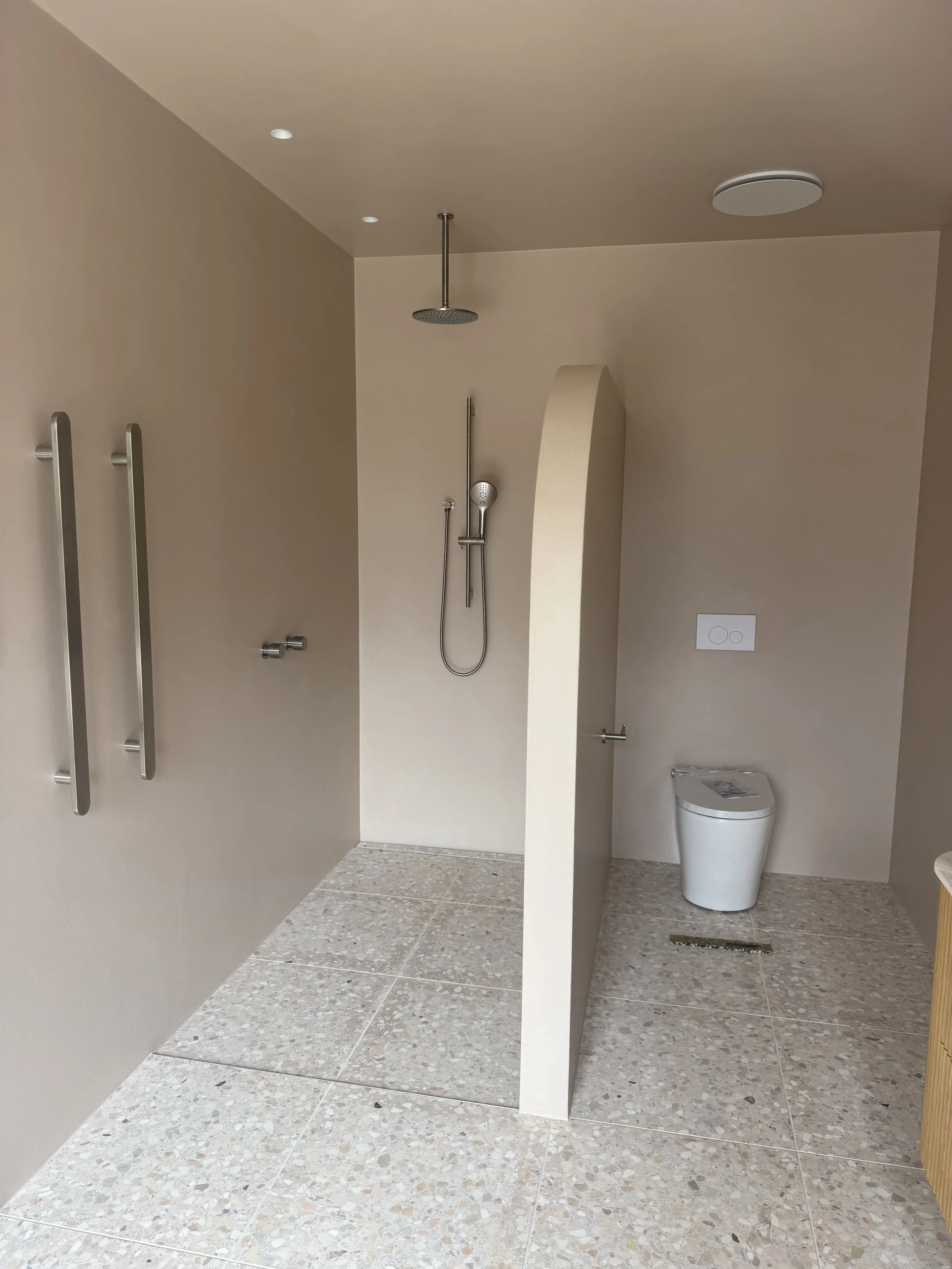 Seamless microcement bathroom finish with grout-free walls and floor, Melbourne