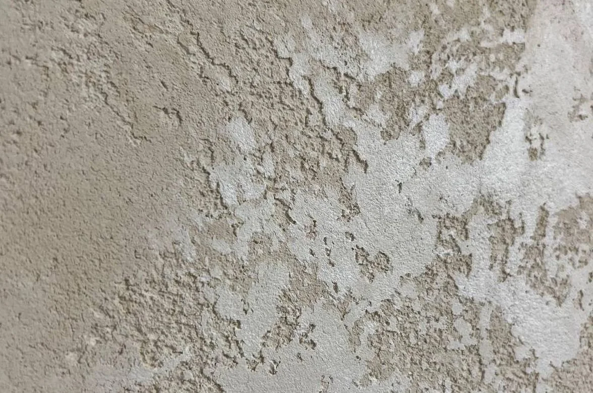 CASTELLO travertine stone coating sample, open pitted texture in Travertine White — Elf Decor · CASTELLO ground travertine coating sample, banded stone effect in Warm Beige — Elf Decor