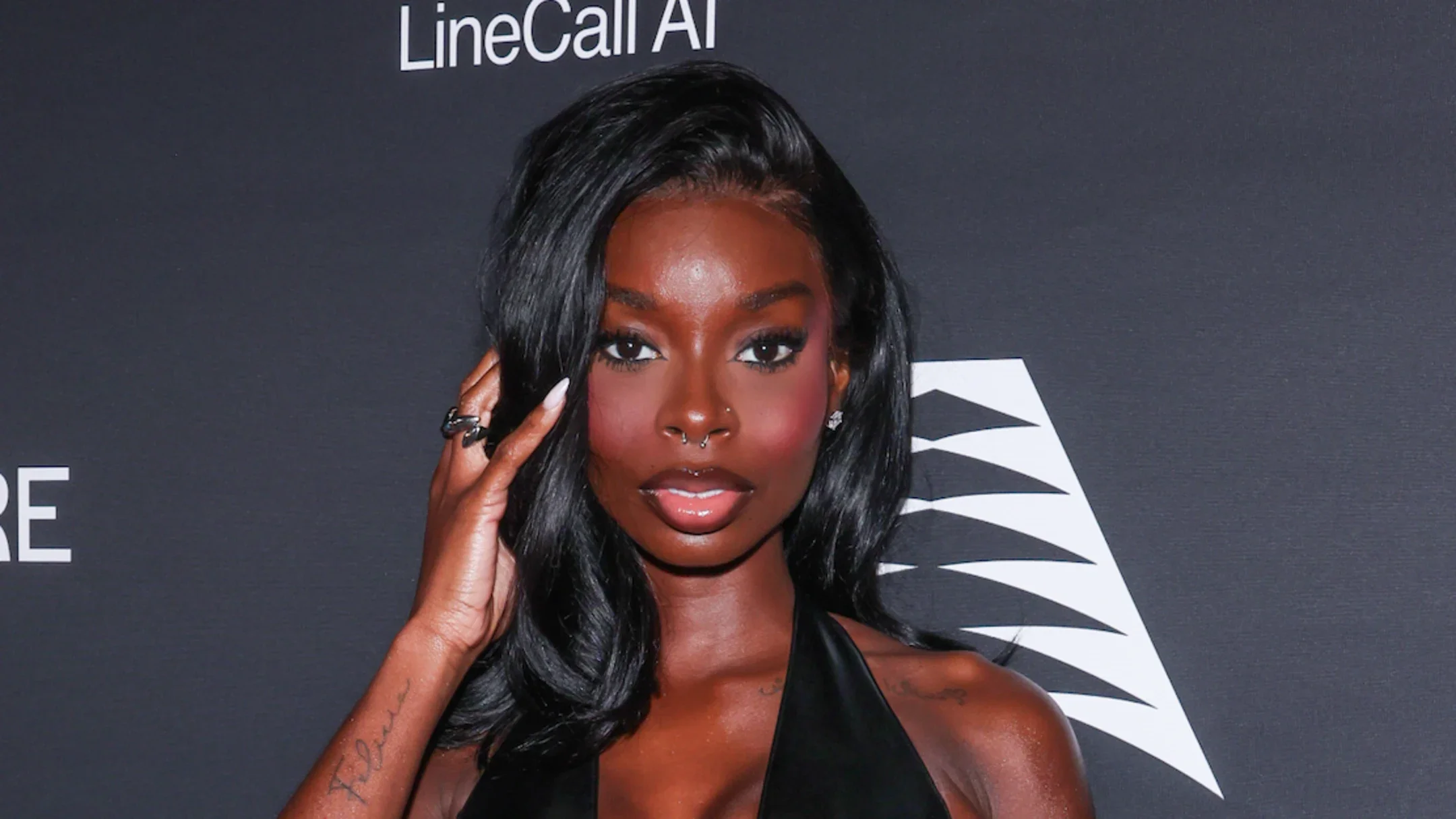 Olandria Carthen Continues Corpcore Trend With Coordinating Pinstripe Look for ‘InStyle’