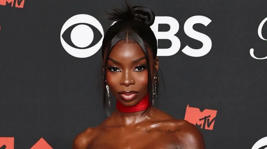 Olandria Carthen Embraces Y2K Energy in Vintage Designer Look for Cardi B Concert