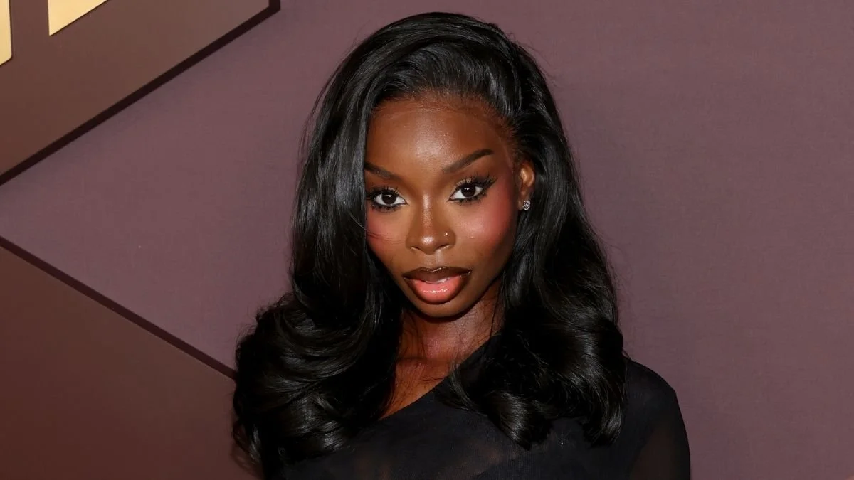 Olandria Carthen Elevates Fully Sheer Do Long Bodysuit With Micro Miniskirt