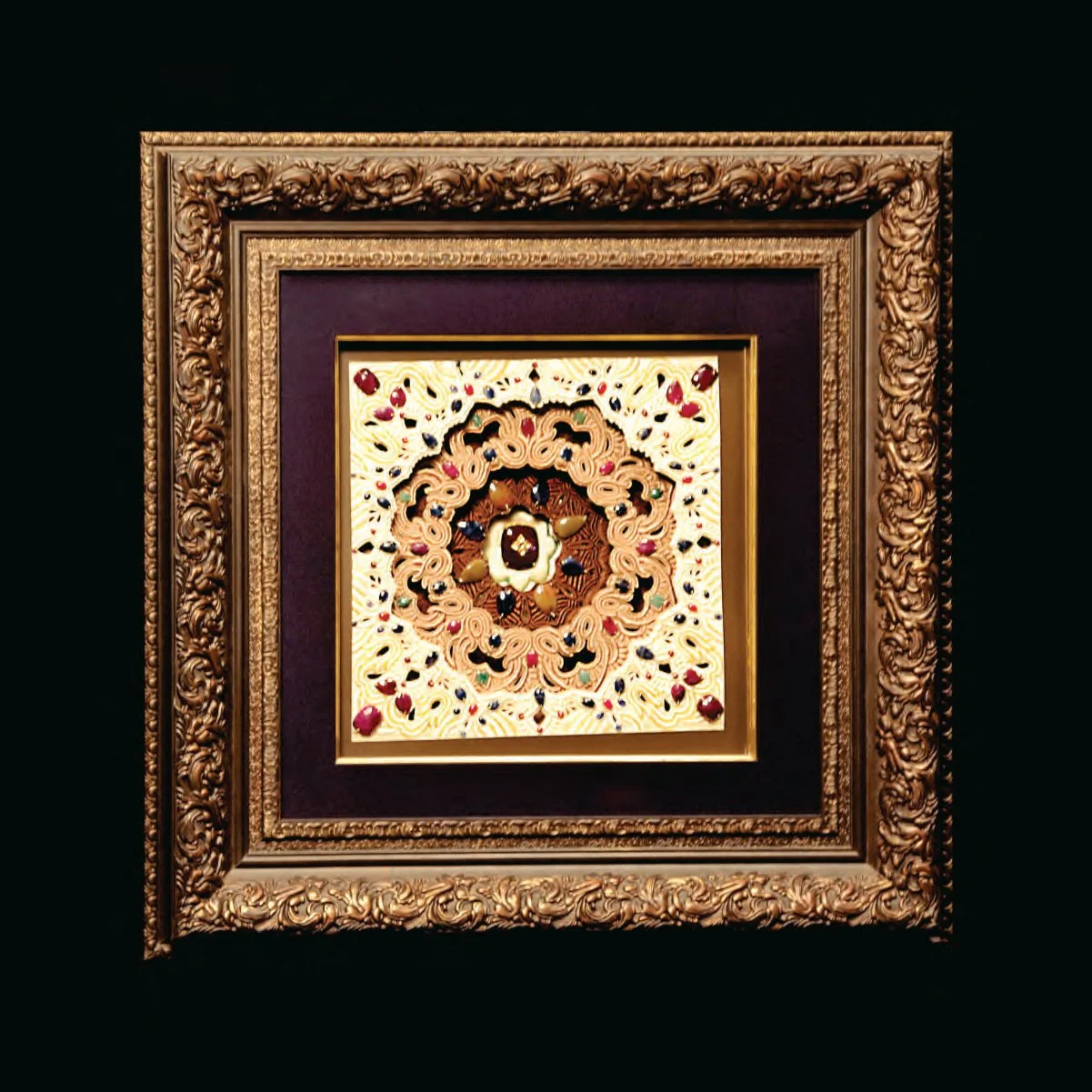 A detailed, ornate framed artwork with intricate swirling patterns and colorful decorative elements, displayed against a black background.
