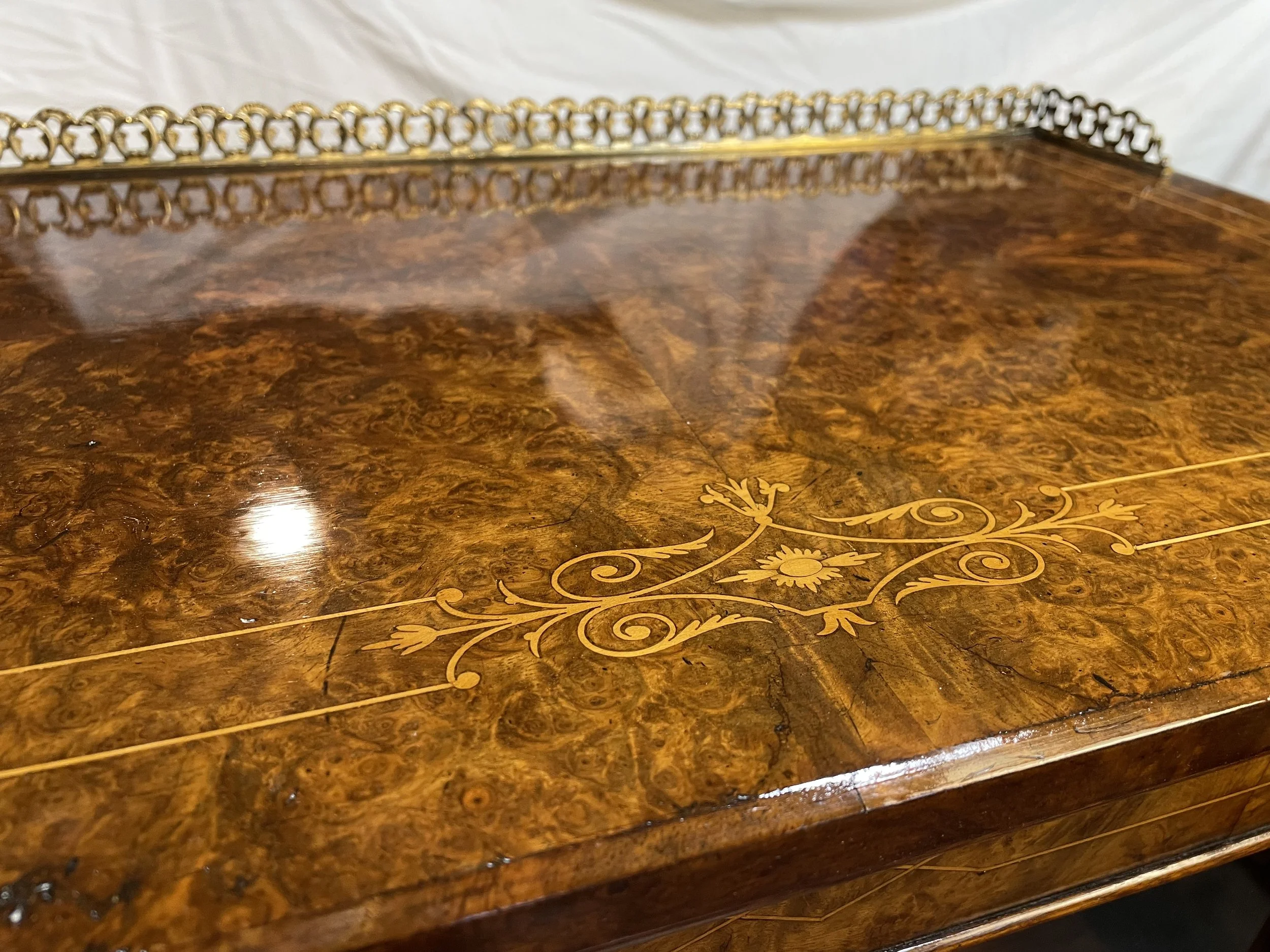 Did a modified French polish on the top to bring back the depth. It didn't need a refinish and sanding could have damaged the delicate inlay. 