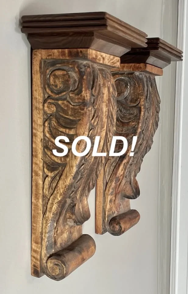 Solid hardwood hand carved corbels with newly added hand carved walnut shelves