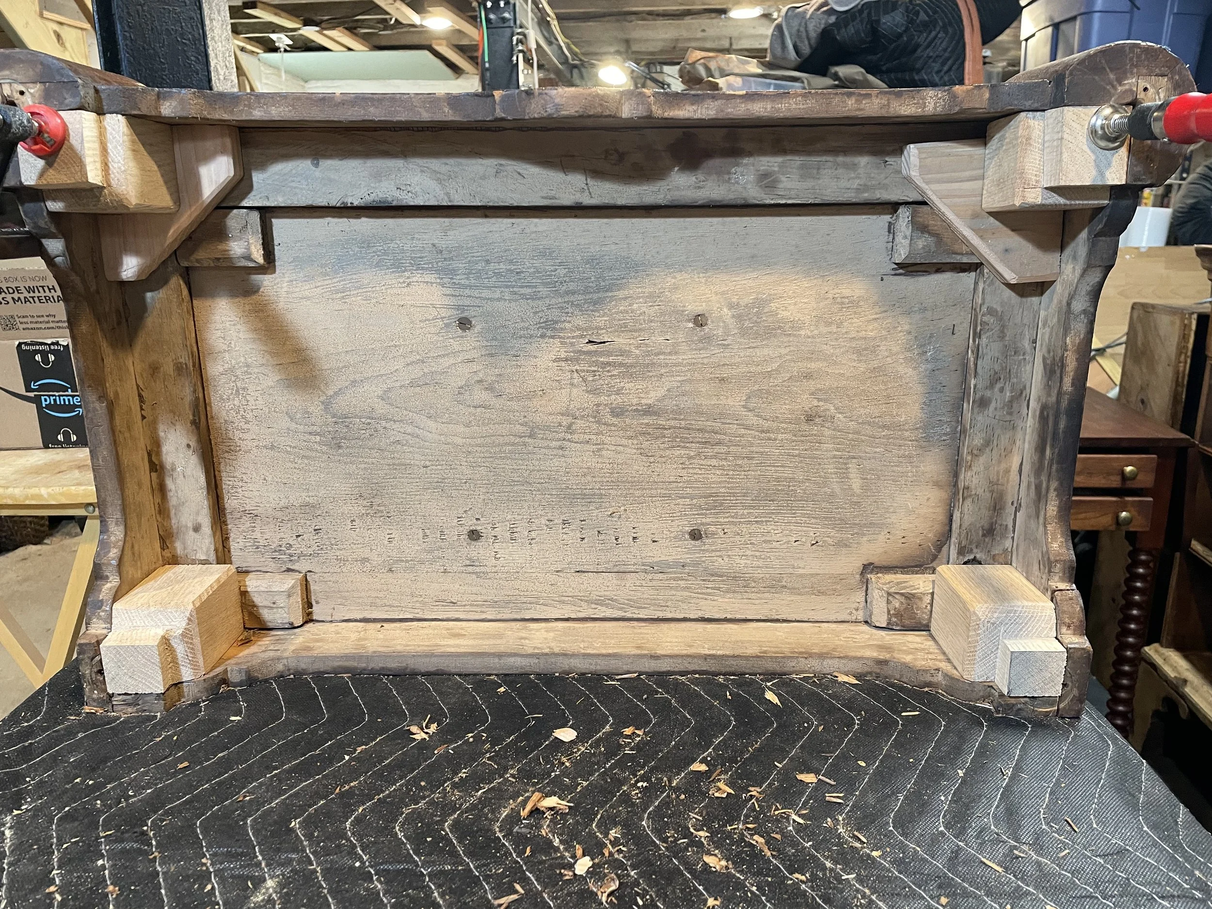 My concept for transferring load on the projecting front feet to the case. A triangular block that transversed the case structure and then sitting the new corner blocks on top of that. 