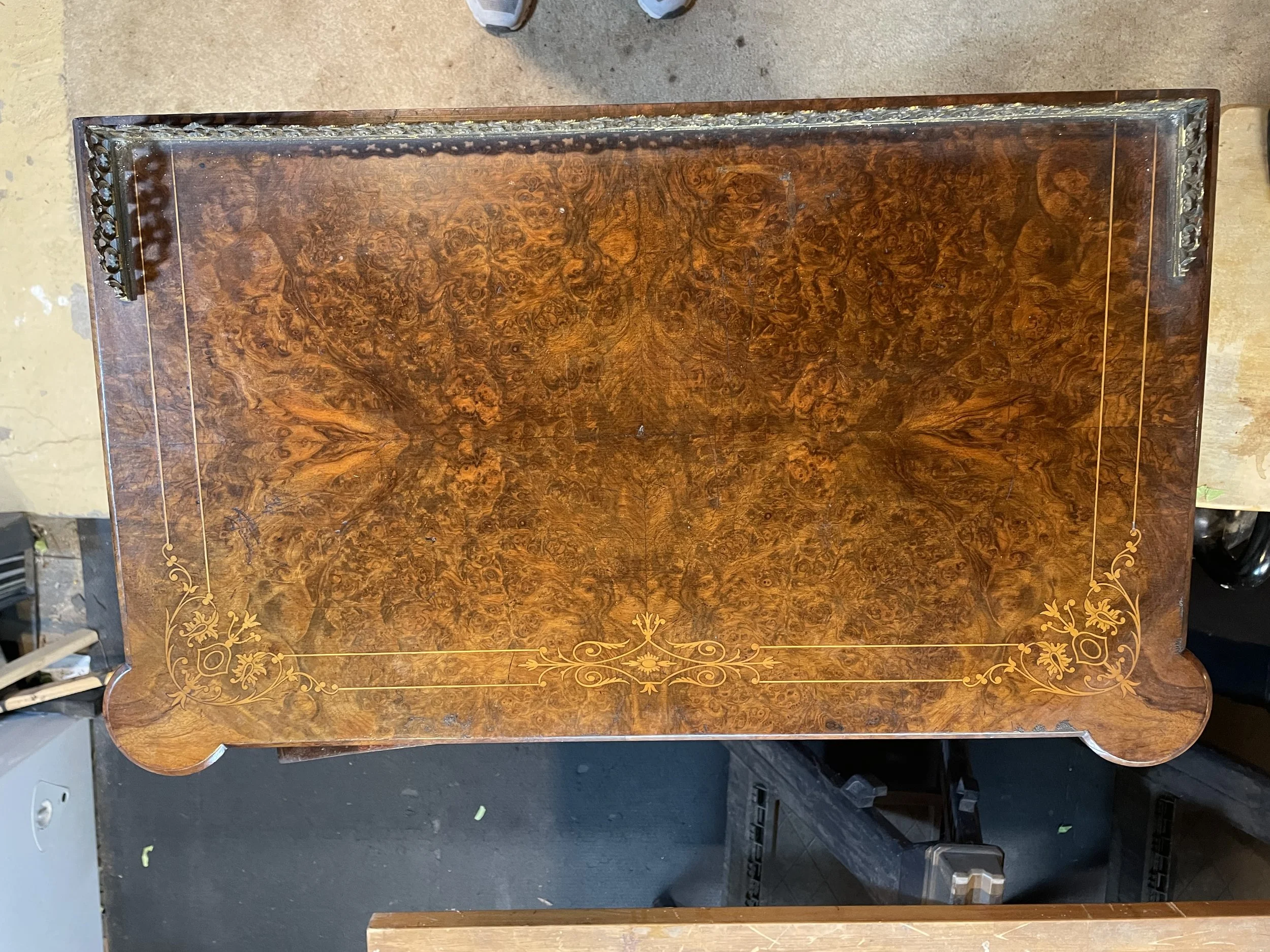 The top is an outstanding burl walnut. But needed a little refresh. Wouldn't you after a century? 