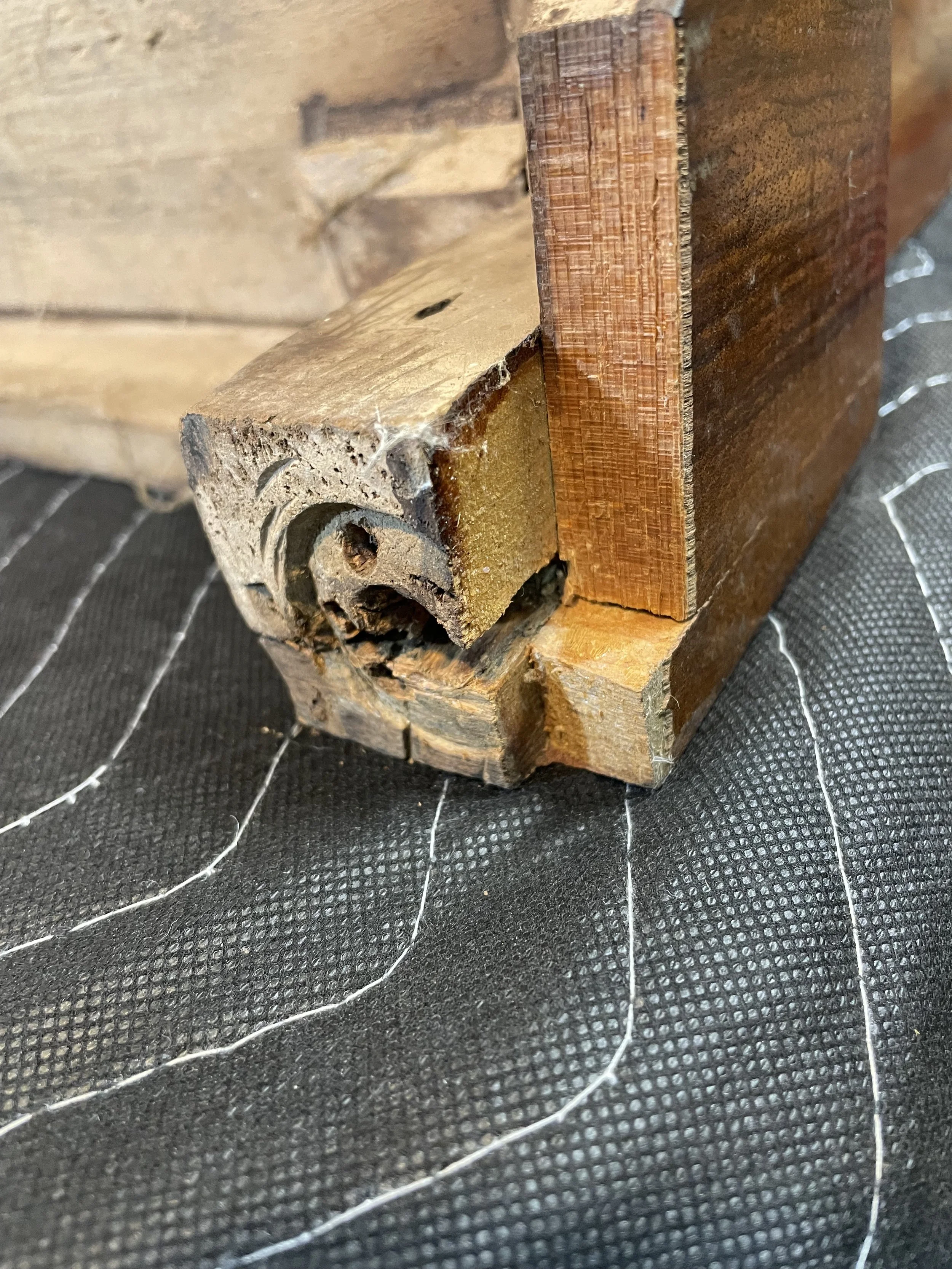 A prior caster failure. As you can see, it was just screwed in and at the joint of the corner glue block and the bottom skirt. 
