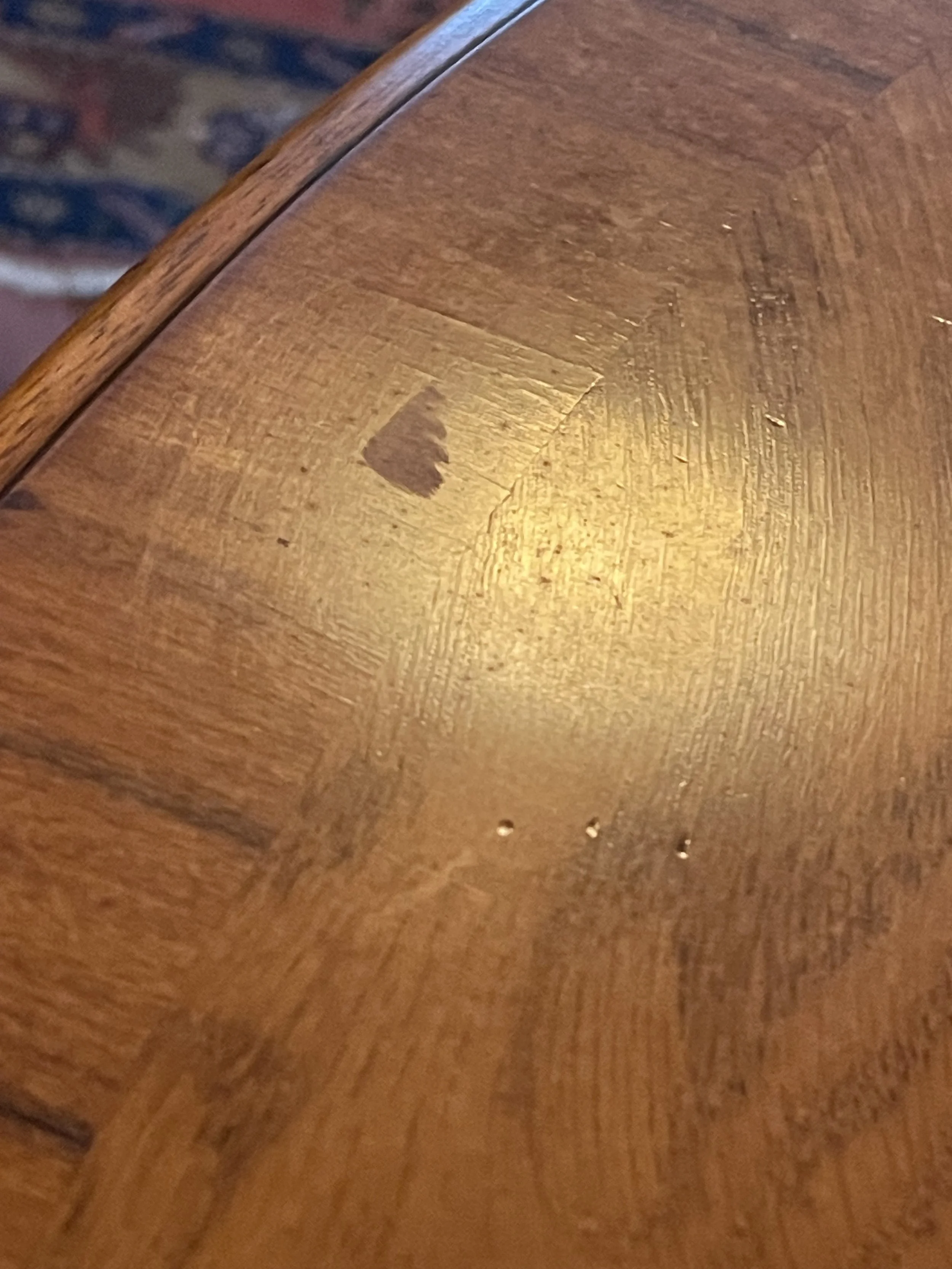 Refreshing, not stripping, the French polish was necessary to seal off and consolidate historic marks like these. 