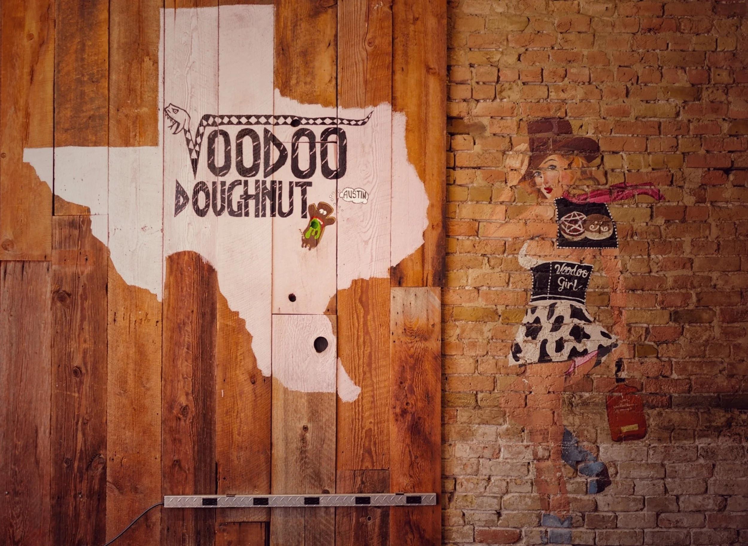Texas in Pink with a Cowgirl showing the Voodoo Doughnut Logo