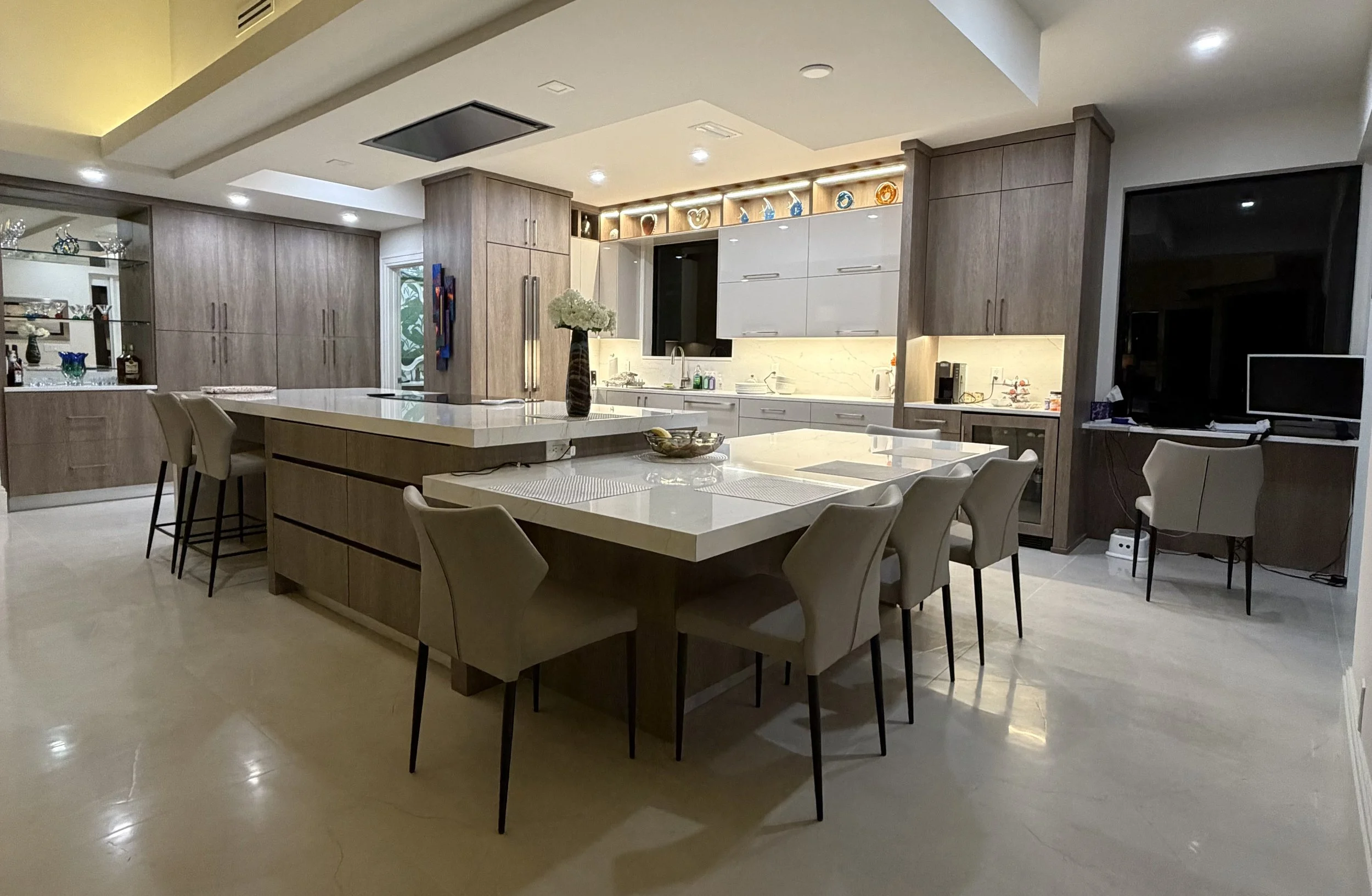 This luxury modern kitchen combines custom details and thoughtful planning to create a true centerpiece of the home. The spacious island with integrated table make this expansive kitchen designed for effortless entertaining.
