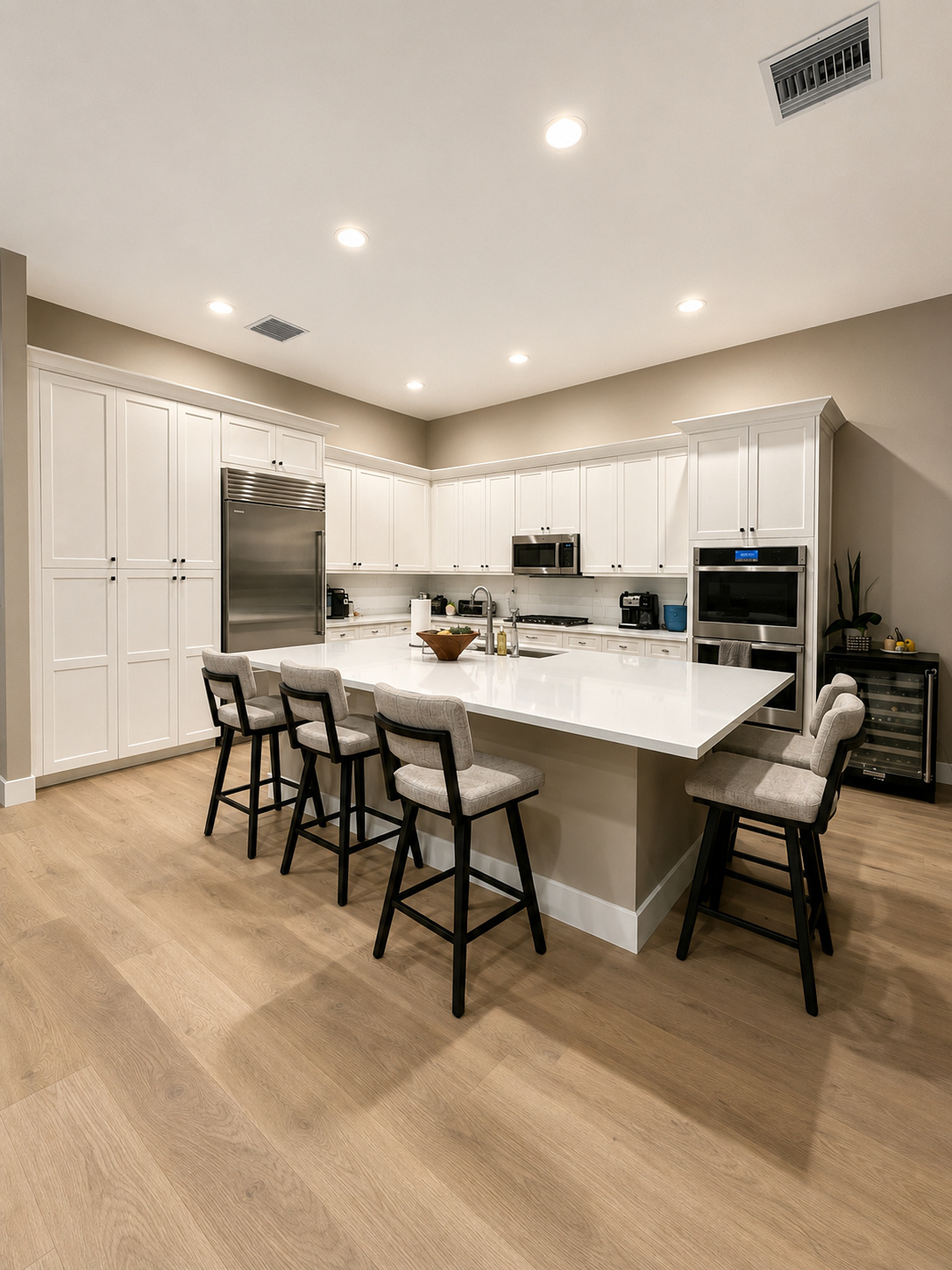 BEFORE: A clean and functional kitchen with bright finishes and an efficient layout feels simple and practical but begs for a more elevated design aesthetic.