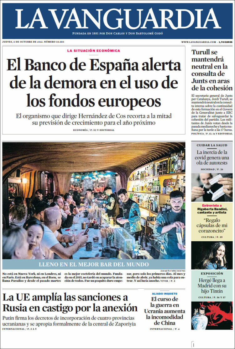 Front page of La Vanguardia newspaper featuring headlines about Spain's economic situation, European funds, and Ukraine conflict, with a large photo of a lively bar filled with people enjoying drinks.
