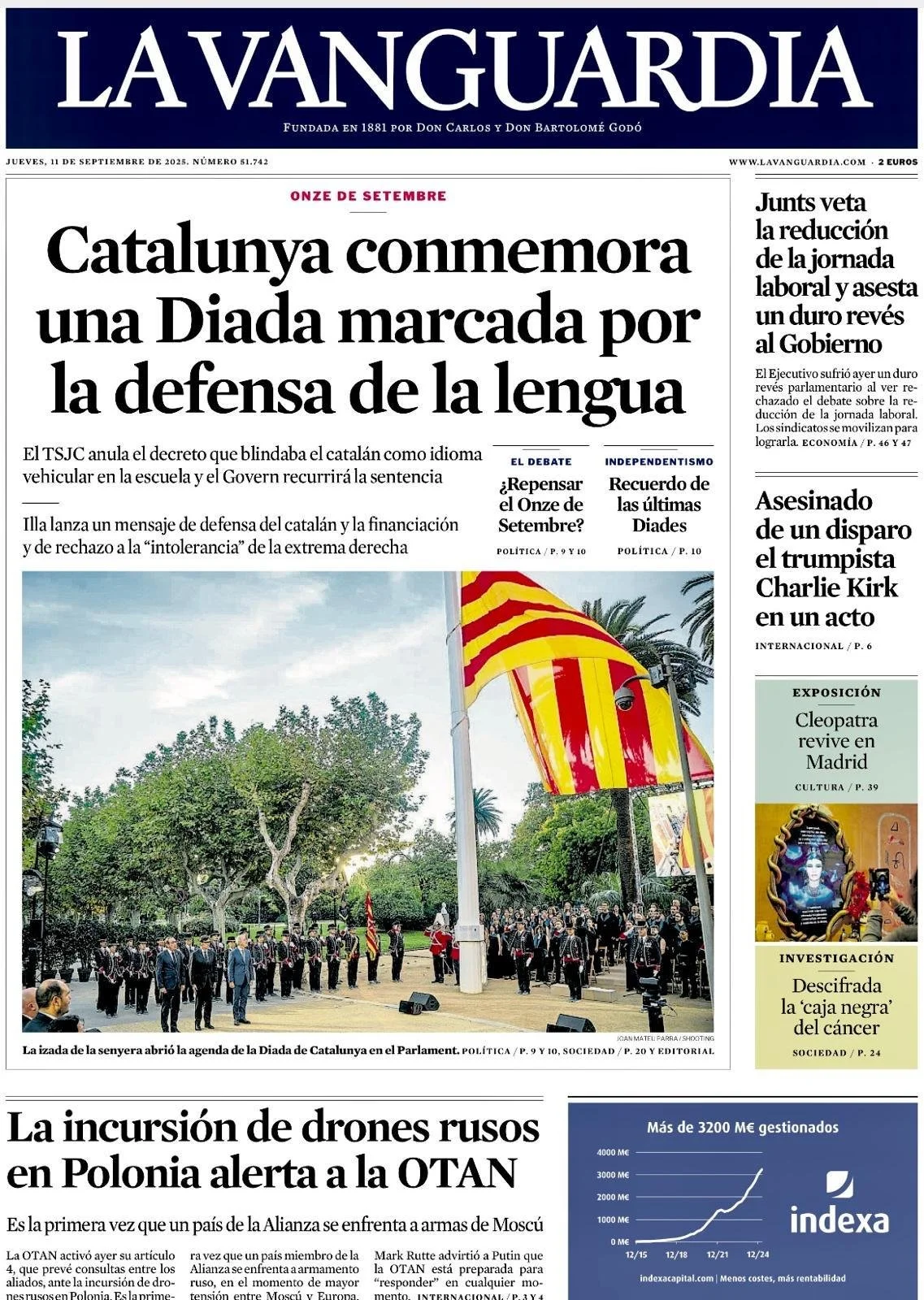 Front page of La Vanguardia newspaper with a headline about Catalunya commemorating a day for language defense, a photo of a public event with flags, and smaller articles on various topics.