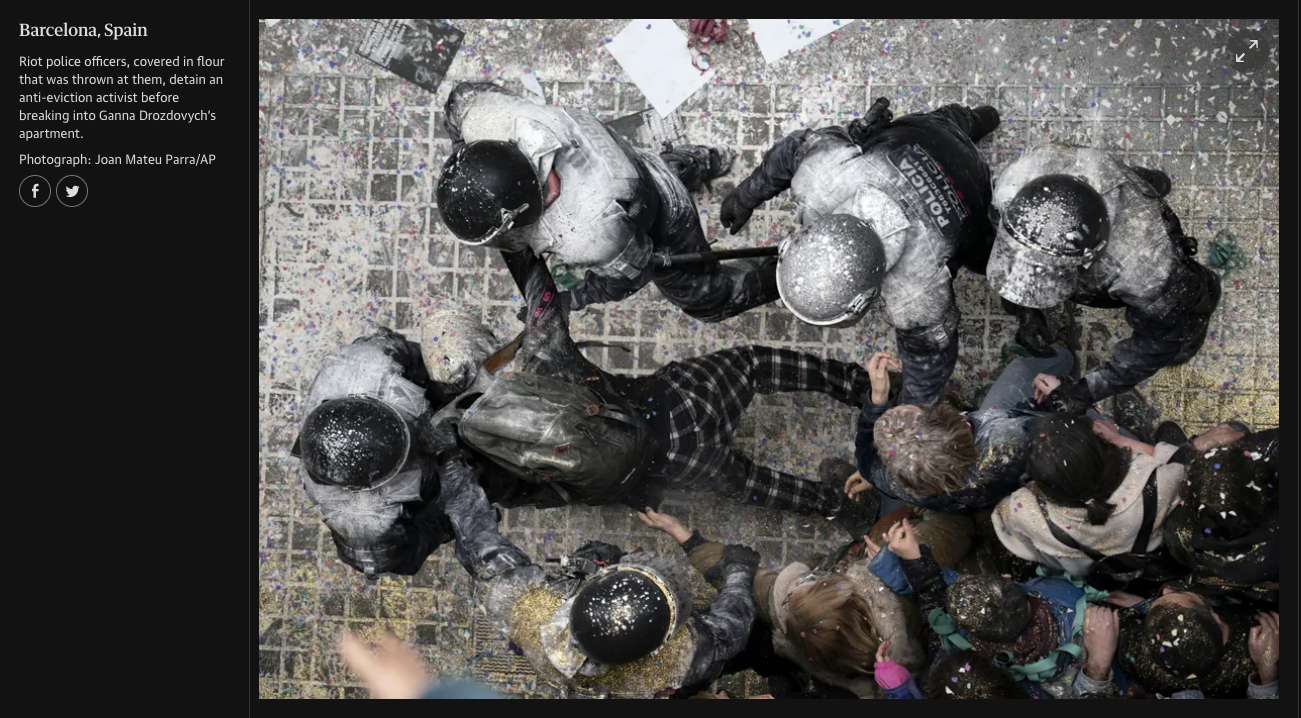 Police officers in riot gear detain and scuffle with protesters during a celebration in Barcelona, Spain, with confetti strewn across the ground.