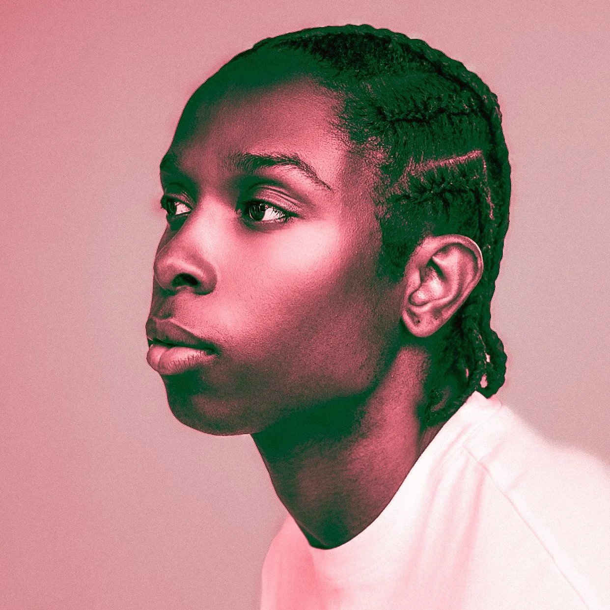 Profile of a young Black woman with short, styled hair, looking to the side against a plain background.