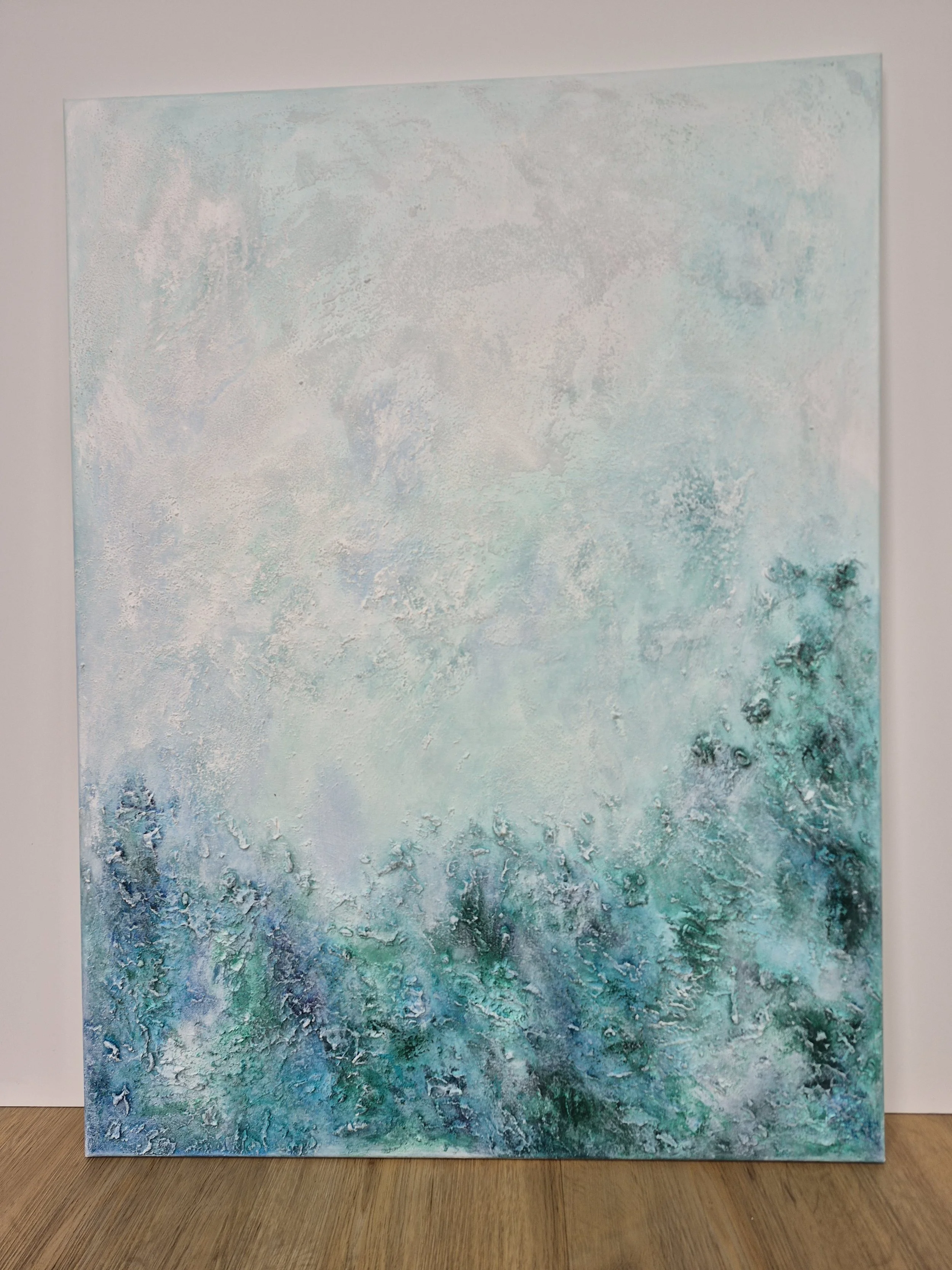 Skab en rolig atmosfære med to matchende abstrakte malerier i blå og turkise toner.