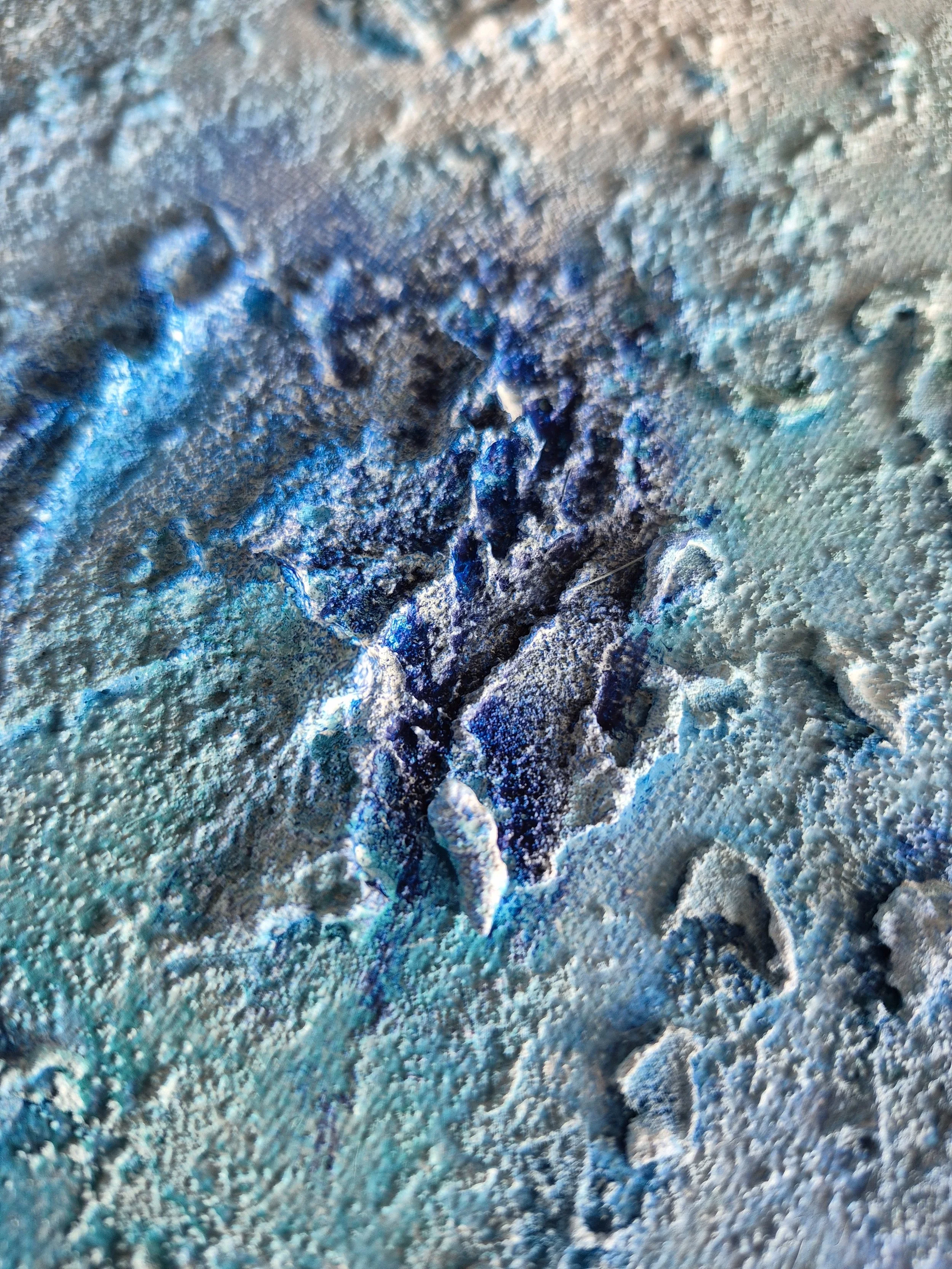 Skab en rolig atmosfære med to matchende abstrakte malerier i blå og turkise toner.