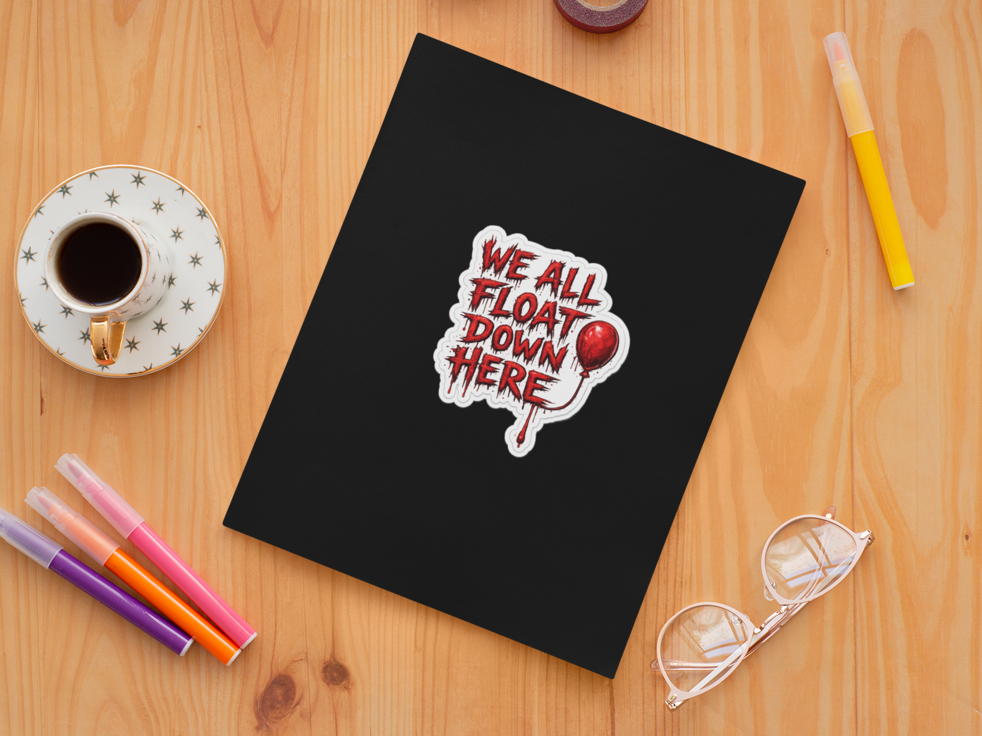 sticker-mockup-featuring-a-notebook-and-some-markers-33624.png
