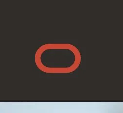 Close-up of a black background with a red oval shape in the center.