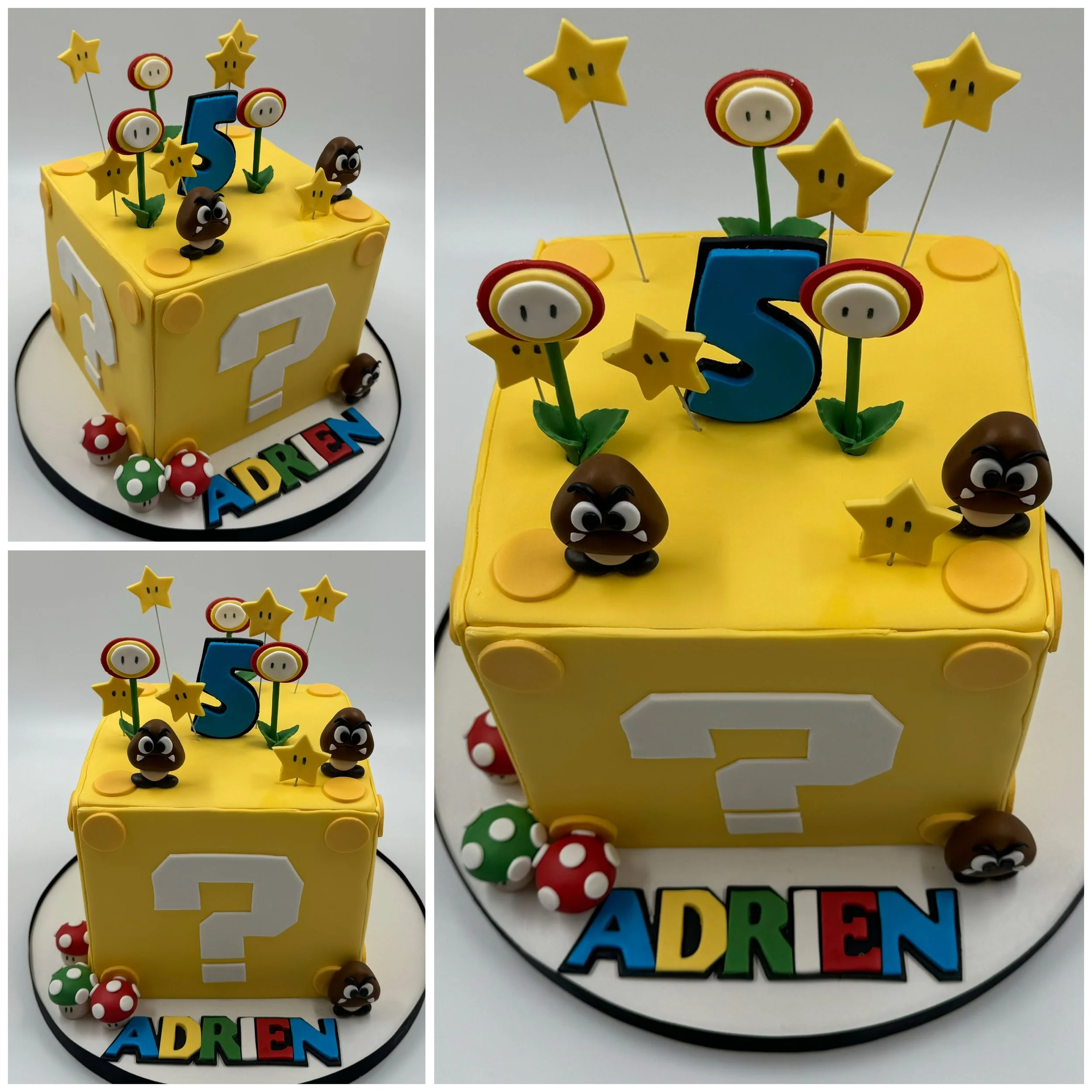 Yellow birthday cake themed after Super Mario with decorations including star, mushroom, and Goomba characters.