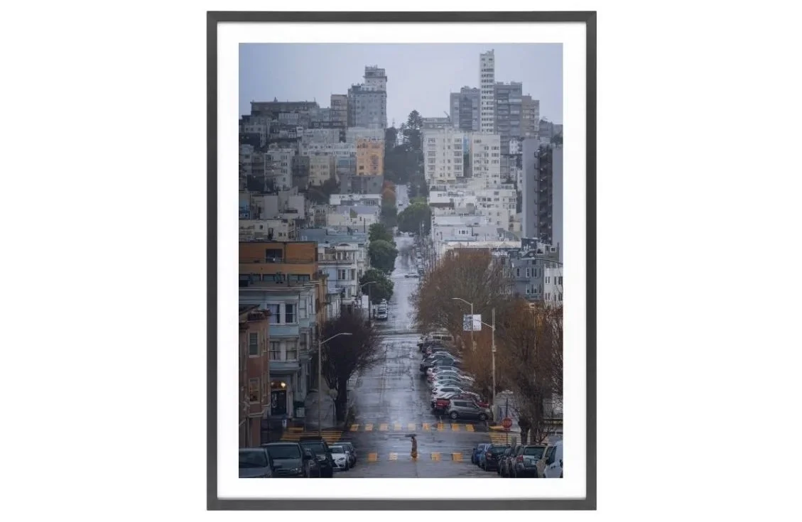 Hills and a man with an umbrella walking