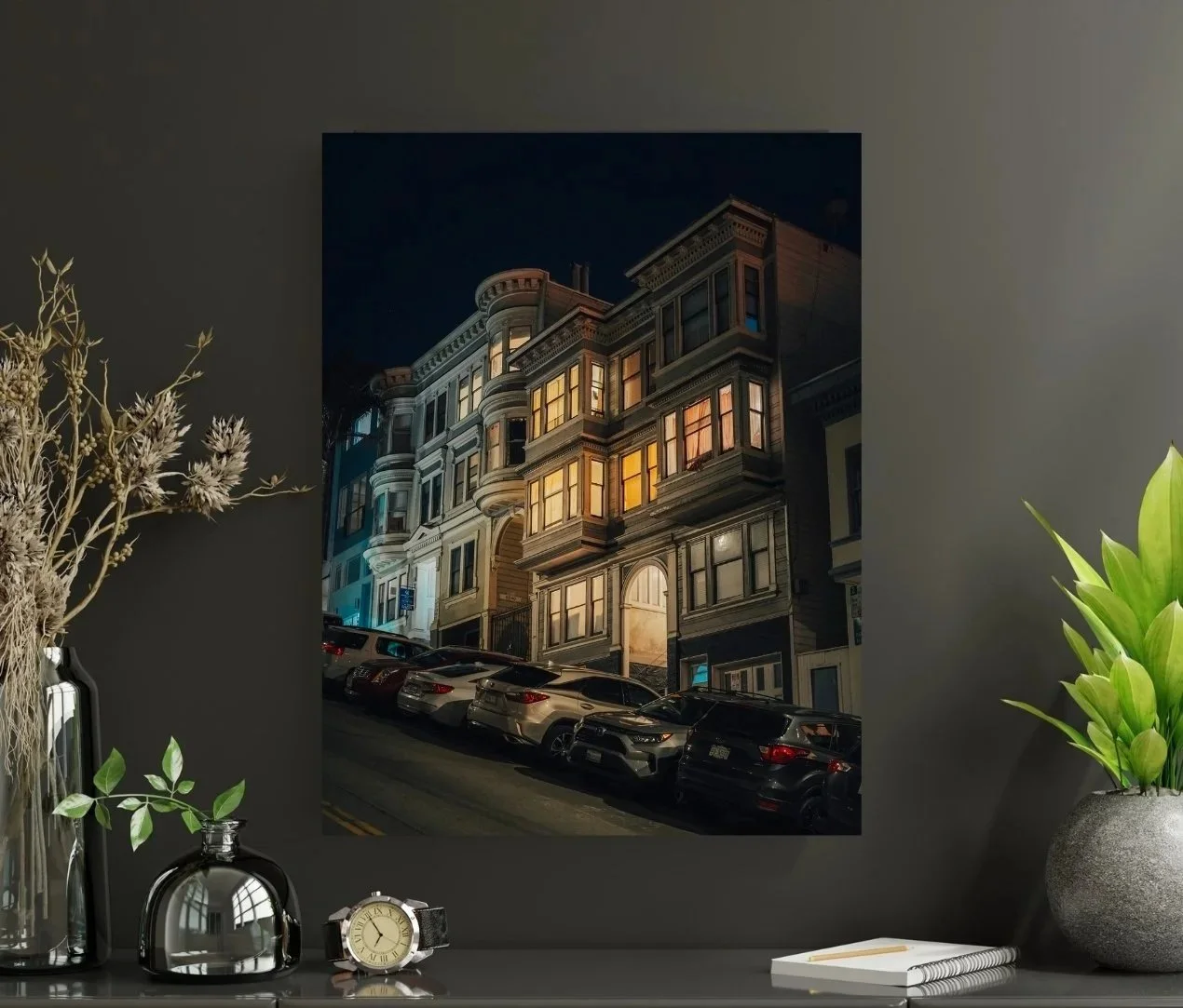 Night view of North Beach houses lit from windows, seen from the bottom of the hill.