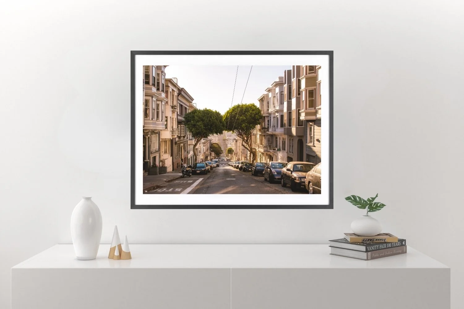 Two trees with touching crowns over a steep road in Russian Hill, San Francisco, lit by warm sunlight and vibrant colors.
