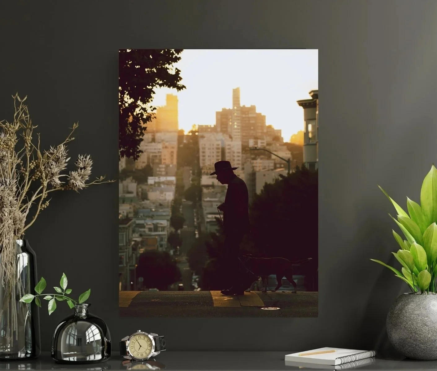 Silhouette of a man walking his dog on Grant Avenue in San Francisco at sunset with city skyline