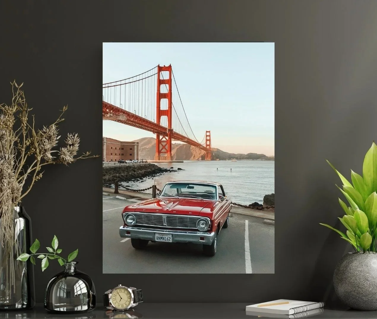 Print of a shiny red vintage car on the way to Fort Point with the Golden Gate Bridge in the background