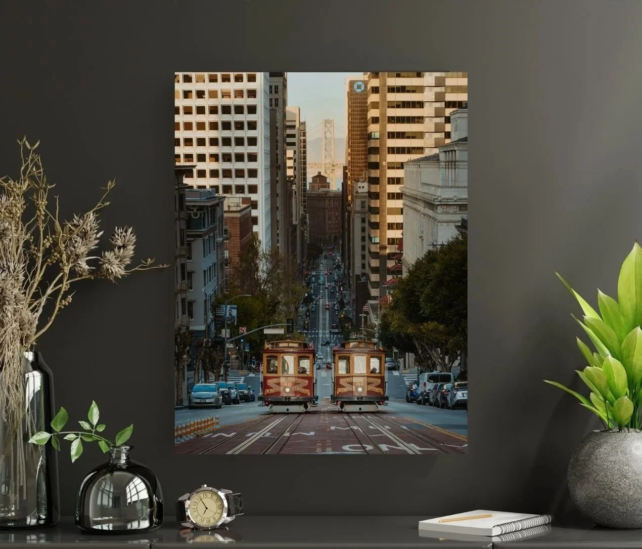 Fine art print of two San Francisco cable cars passing on California Street with the Bay Bridge in the background.