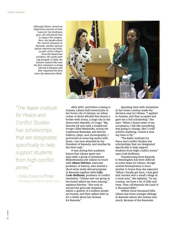 Two women speak at a podium during a presentation in a room with American flags in the background. One woman is gesturing while the other listens. Feature article news writing reporting creative writing.