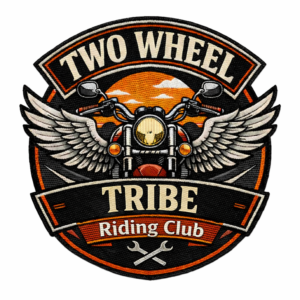 A patch or emblem featuring a motorcycle with wings, set against a sunset background, with the text 'Two Wheel Tribe Riding Club'.