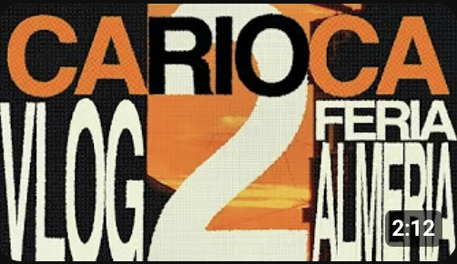 Text reading "Carioca Vlog 2 Feria Americana" on a colorful background.