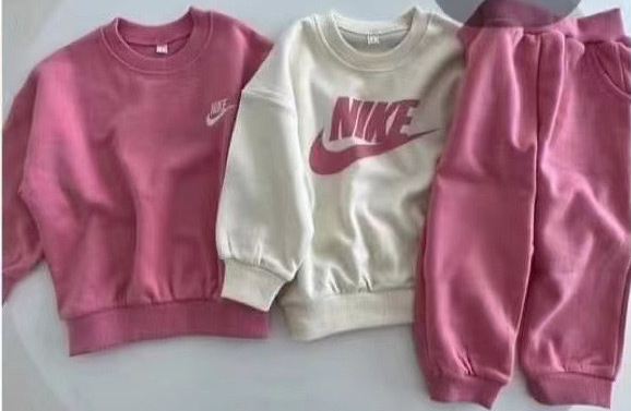 Pink Nike Jogging Suit.png
