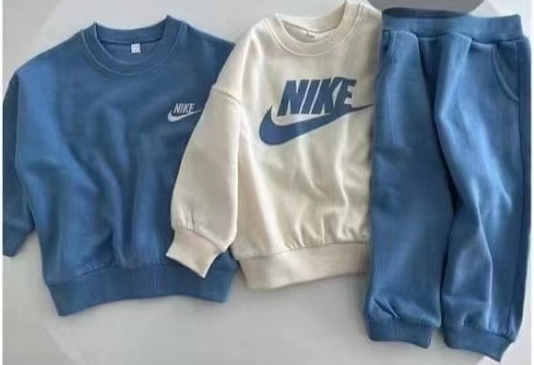 Blue Nike Jogging Suit.png