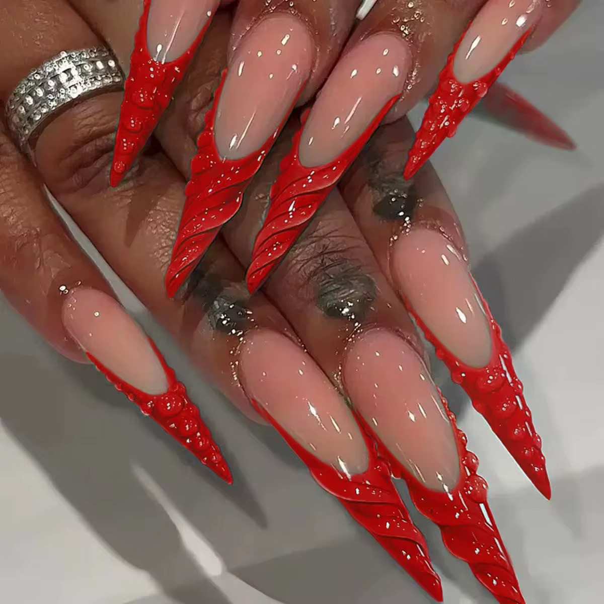 Red water design Long Stiletto nail.png