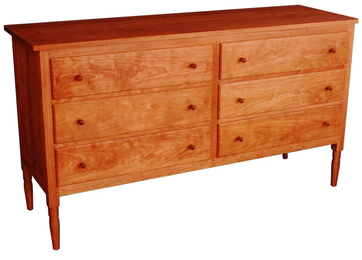 shaker six drawer chest with turned legs made from cherry