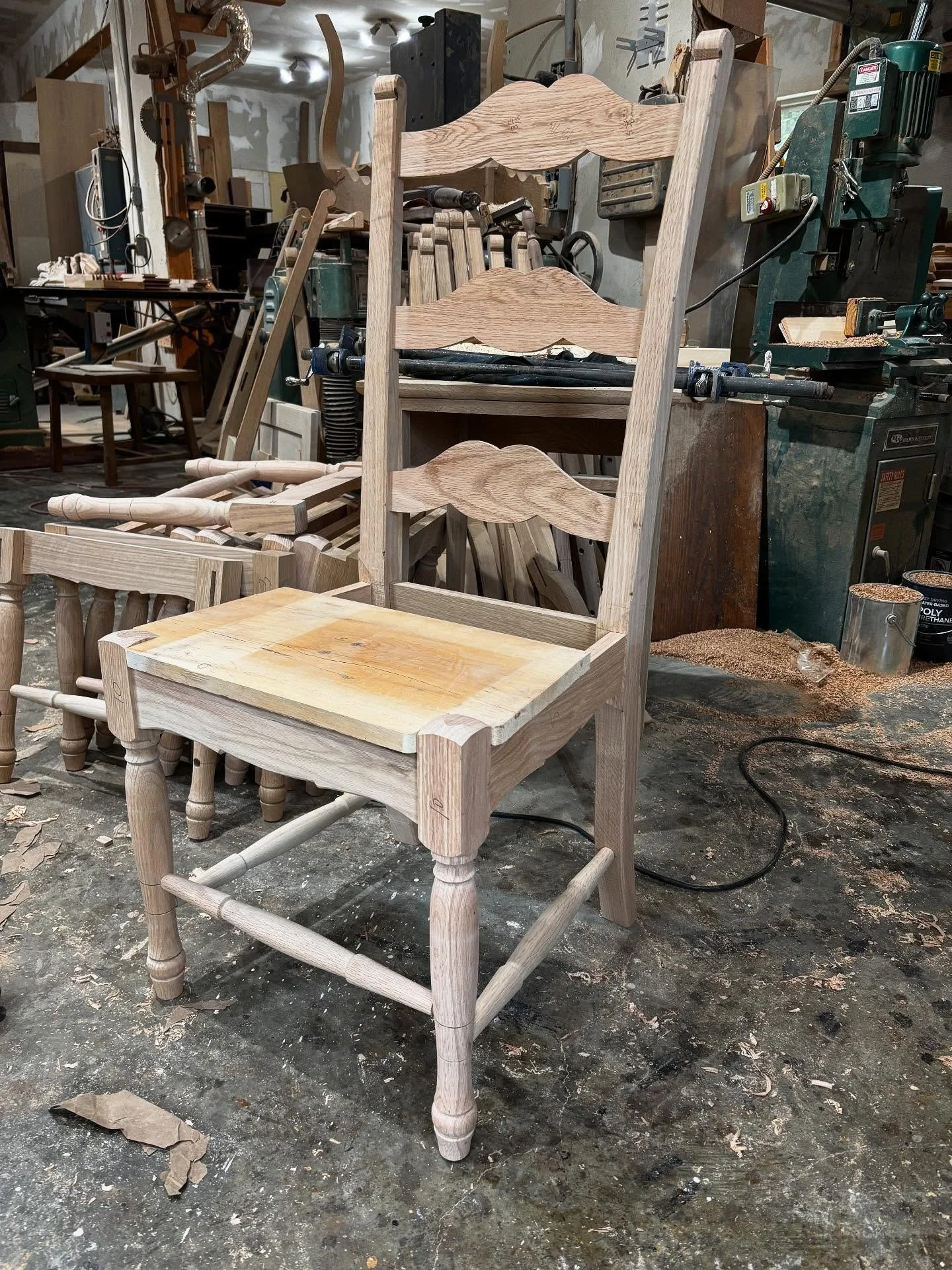 Roughly set together. My newest chair design. The splayed back posts have compounded this chair production. Steam bent back slats and hands shaped back posts add to its elegance. Not sure what I will name this chair. French Country inspired. Any thou