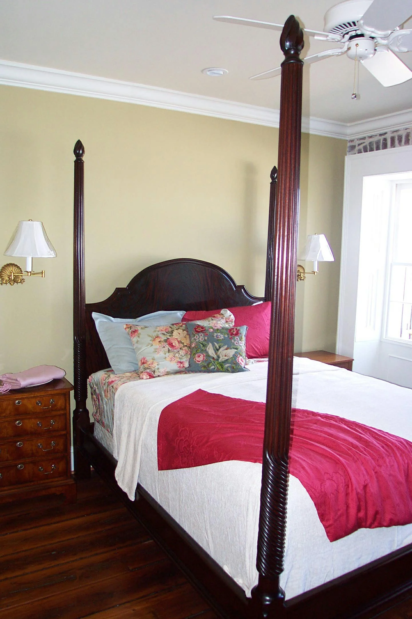 tall post bed with reeded bed posts and large hedboard