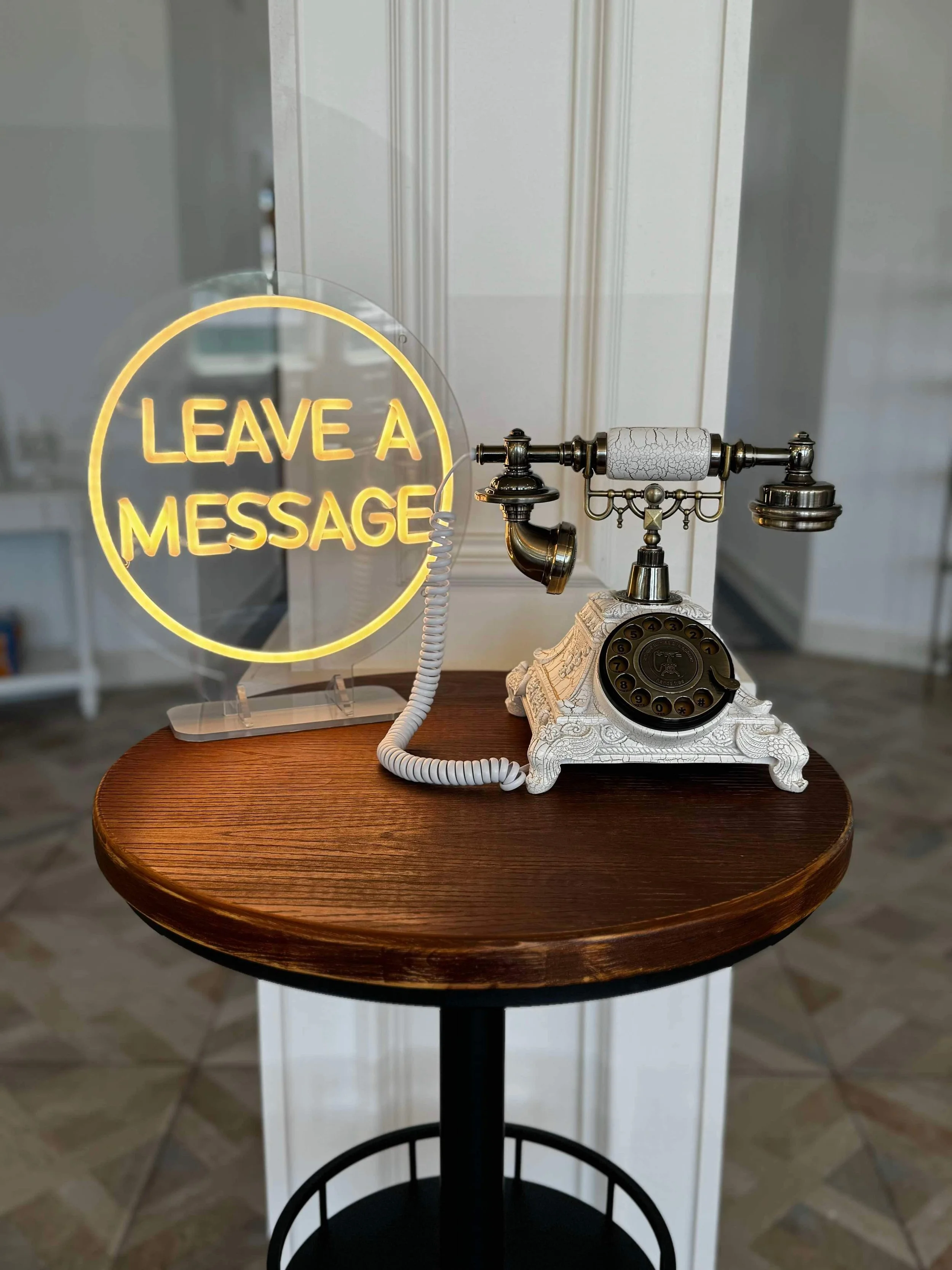 Audio Guest Book in the shape of an antique phone with an illumiated sign that says "Leave a Message"