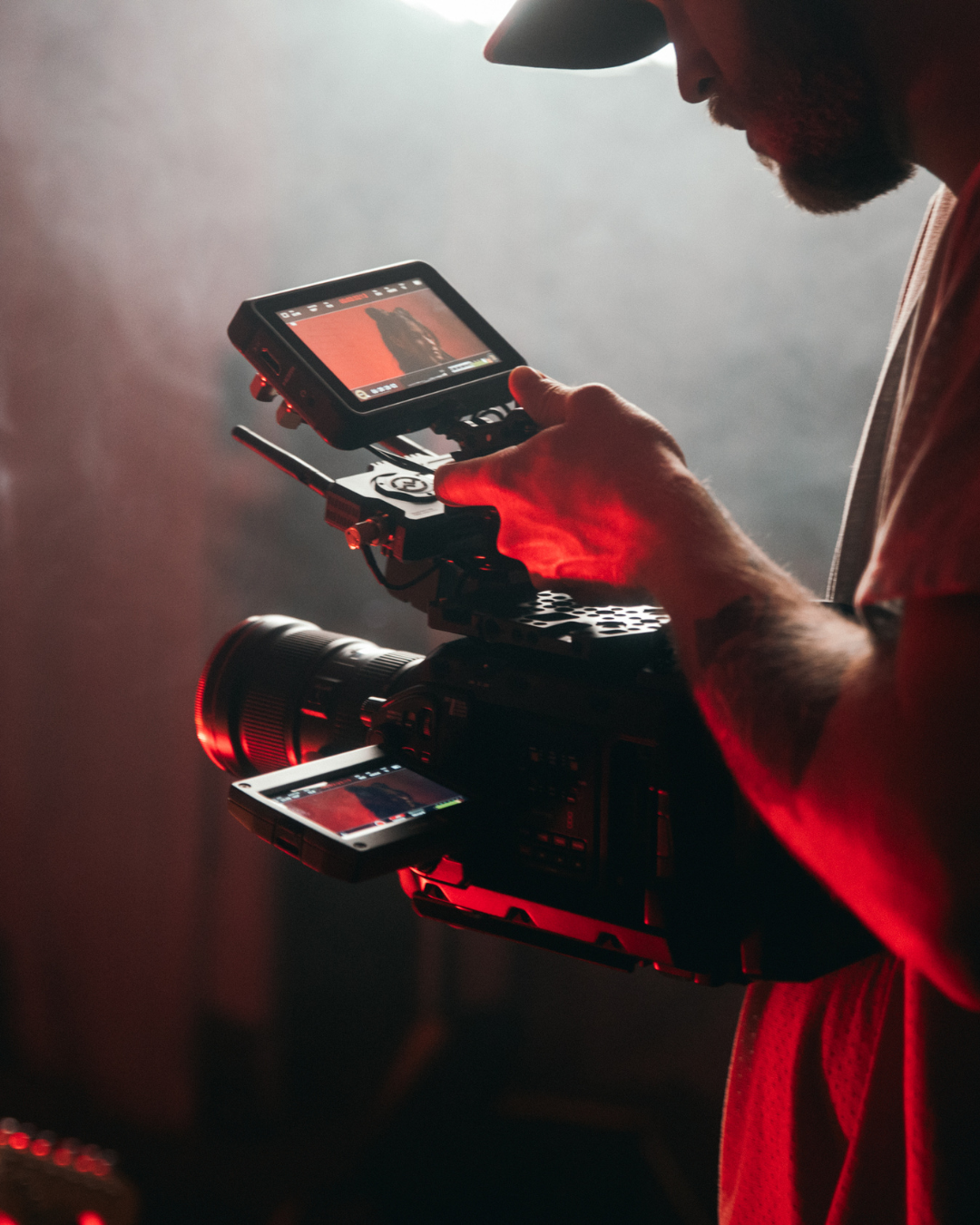 Digital video camera operator with smoky background