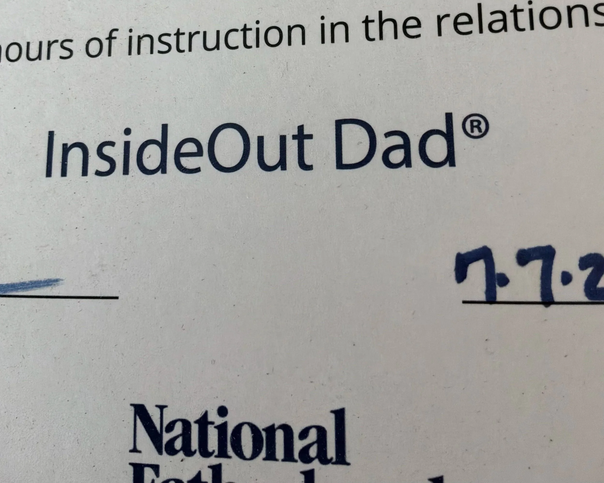 Close-up of a printed publication with the word 'InsideOut Dad' in large font.  Proof of dutiful work while incarcerated unlawfully.  See judicial audit.