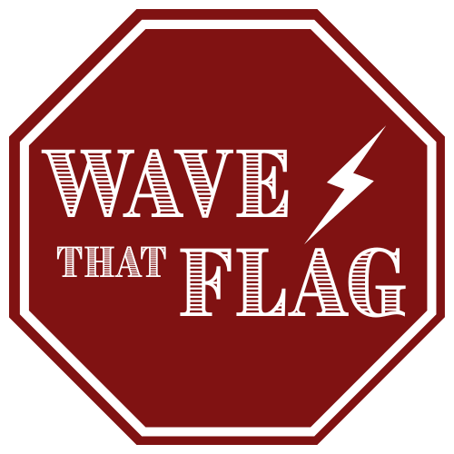 Dark Red octagonal sign with white text that reads 'WAVE THAT FLAG' alongside a white lightning bolt symbol.