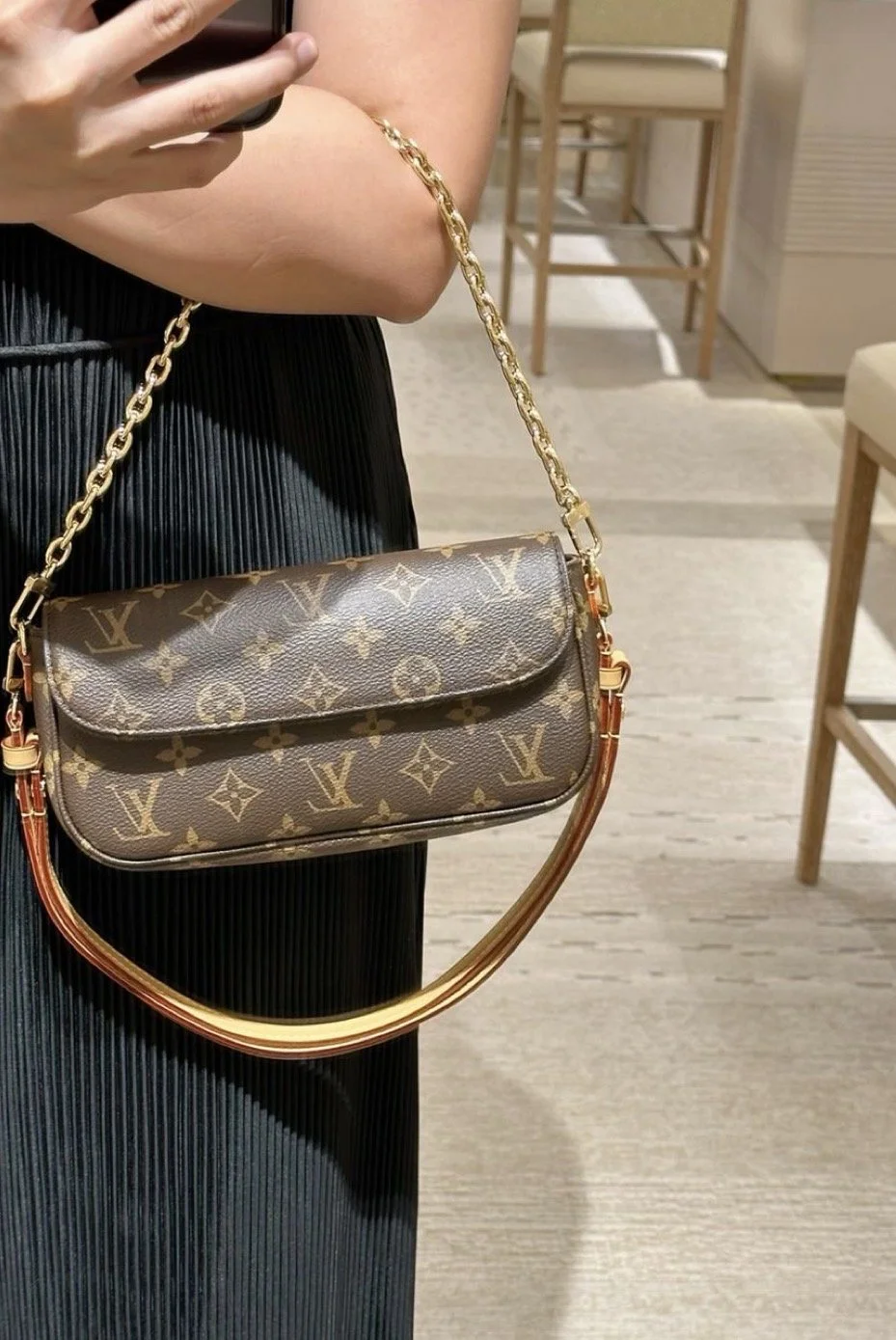 Authenticated Louis Vuitton handbag with gold chain strap. Carefully reviewed and offered through Muse’s luxury resale platform.